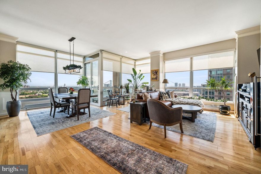 Waterfront Square Condominium & Spa sets the standard for luxury living in Philadelphia, boasting unmatched amenities and round-the-clock security, including 24/7 guarded gate and building concierge services. This exceptional residence features two Parking Spaces in an attached covered garage and a same-floor Storage Unit, along with three Bedrooms, 2.5 Bathrooms, a Laundry Room, and a private Balcony, perfect for entertaining guests.
As you enter, you'll be greeted by awe-inspiring panoramic views of the Delaware River, the iconic Ben Franklin Bridge, and the City Skyline. The expansive open concept floor plan welcomes you into a spacious Foyer, complete with a convenient Half Bath and a concealed walk-in coat Closet/Pantry combo.
The well-appointed Kitchen seamlessly flows into the Living and Dining areas, boasting cherry cabinets, granite countertops, stainless steel appliances, and a peninsula for additional seating. Adjacent to the Kitchen, a generously sized Office room offers custom built-in cabinetry and serene water views.
Step outside onto the private Balcony, accessible from the Living and Dining areas, to indulge in breathtaking views of the water from the east, north, and south, perfect for enjoying morning coffee, evening sunsets, celebratory fireworks and intimate outdoor gatherings.
As you follow the floor-to-ceiling Windows, you'll be led to the Corridor where three large Bedrooms await, each offering enchanting sunset views, shimmering water vistas, and the lively city skyline. The Primary Suite is a sanctuary with its panoramic vistas, fully integrated walk-in Closet, and a lavish ensuite Bathroom featuring a stall shower and a generously sized Jacuzzi tub. Completing this area is another full Bathroom and a spacious Laundry and Storage Room, providing both convenience and functionality for everyday living.

Throughout the home, meticulous attention to detail is evident, with features including recessed lighting, oak engineered floors, crown molding, wainscoting, custom remote blinds and shades in every room and 3 heating and cooling zones. 
Residents have access to a host of amenities, including a well-equipped Fitness Center, sauna, steam room, junior Olympic-size indoor pool, massage facilities, instructor-led fitness classes, and community rooms. Additionally, Waterfront Square has 3 Dog Parks and is home to Philadelphia’s largest Green Roof, offering a small Play Area and a large Park-like setting.
Situated on a 9.5-acre riverfront enclave, Waterfront Square's prime location near major highways, airports, and bridges, combined with its tranquil setting on the Delaware River, makes it the premier choice for luxury living in Philadelphia, offering unparalleled views and an abundance of amenities.