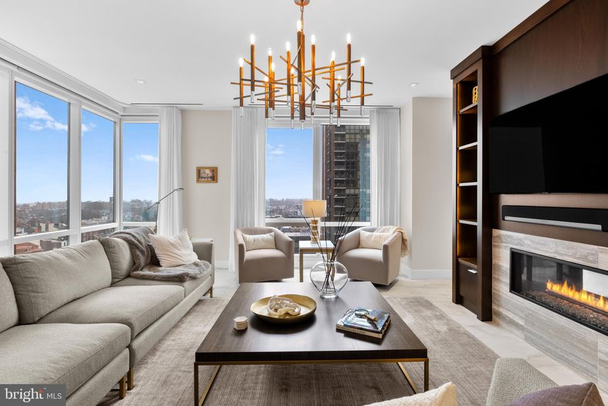 Rarely offered on the market, the south-facing 10th-floor Residence is a breathtaking 3-bedroom, 3.5-bathroom home located in the iconic 500 Walnut. This distinctive building, designed by the esteemed architect Cecil Baker, represents a unique boutique luxury condominium positioned in Society Hill, just off Washington Square. Step into this light-filled space through an elegant gallery featuring high ceilings that flow seamlessly into the open living and dining area, adorned with floor-to-ceiling windows and southern exposures. A striking feature wall separates the rooms, outfitted with a gas fireplace, built-in television, and a custom-lit art gallery. The kitchen, expertly crafted by Joanne Hudson, boasts marble countertops, under-cabinet lighting, and top-tier appliances, including a Sub-Zero refrigerator, Wolf oven, microwave, stovetop, Asko dishwasher, and a beverage station complete with wine storage and two drink drawers. 

Adjacent to the kitchen is a pantry with glass pocket doors and thoughtfully designed storage. The primary suite offers a private south-facing balcony, a luxurious walk-in closet, a wine fridge, and a coffee station. Its bathroom is equipped with a double vanity marble sink, an oversized shower featuring a waterfall showerhead, and radiant heat flooring. The spacious second bedroom includes ample closet space and its own en-suite bath. The third bedroom, currently functioning as a den and home office, opens from the living area through large pocket doors and overlooks Independence Park. 

Additional features include a sizable laundry room with substantial storage, Lutron motorized window shades, LED lighting, an audio speaker system, porcelain floors, and custom carpeting. 500 Walnut offers the convenience of a doorman building equipped with a fully automated parking system, a pool, a fitness center, massage rooms with steam and sauna, a communal area featuring a couple of outdoor fireplaces, a golf simulator, a billiards area, a boardroom, a pet spa, on-site daily chauffeur service, and a guest suite available upon request for out of town guest. This residence benefits approximately three years remaining on the tax abatement, with a second deeded parking space available at an additional cost. Additional pictures of the residence will be uploaded on January 20th, 2025.