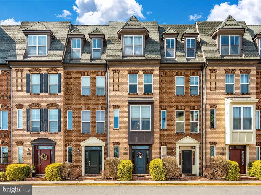 Check out this cozy and stylish four-story townhome with its own private garage at the back. Imagine cooking in a beautiful kitchen with everything you could want—a big island, shiny granite countertops, and modern stainless steel appliances. Plus, it's all open to a comfy family room with a warm gas fireplace, perfect for gatherings. There's even a cool dining space with a unique exposed brick wall. You can head up to the third floor to find the main bedroom suite, a true retreat with a fancy bathroom, a big shower with jets, and a separate bathtub for soaking. The top floor offers another bedroom and flexible loft-style space that could be your third bedroom or a chill spot, leading to a rooftop terrace for fresh air. The basement isn't just a basement - it's a large office or welcoming entry area with a convenient half bath and direct access to the garage. The house faces a peaceful conservation area, so nature is right at your doorstep, complete with trails for walking or jogging. Plus, you're just a hop, skip, and a jump away from shopping, eateries, downtown Frederick, and main roads for easy travel. Note: This gem is being sold as-is, and with a little TLC, you can make it your own