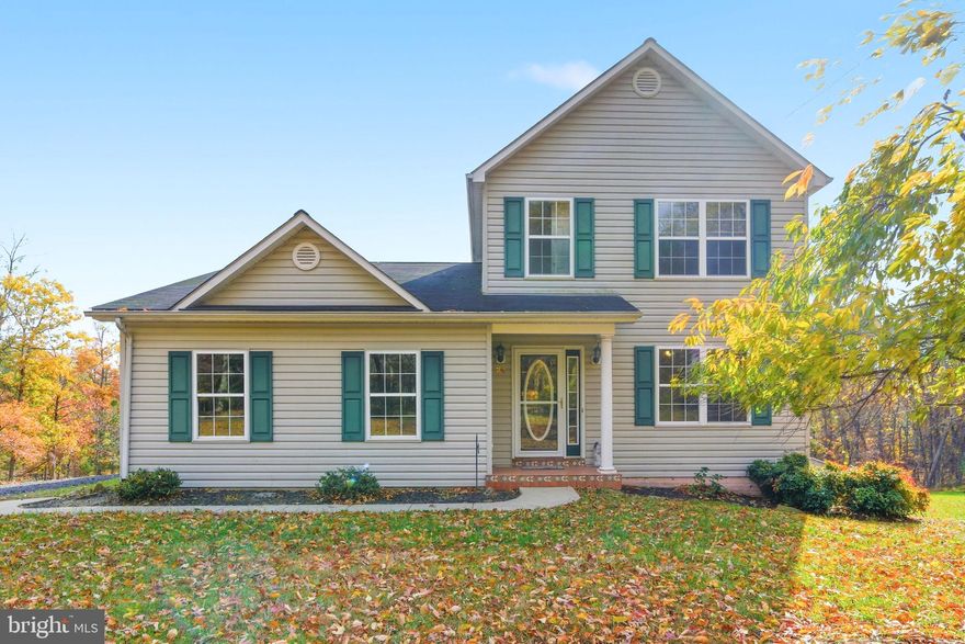 Back on the market with a new price
Lovely 3 bedroom, 3.5 bath home located on a 5 acre partially wooded/cleared lot in the southern part of Morgan County.  This location offers easy access to Winchester, Va. for work, shopping and medical facilities.
The large fairly level lot has a storage shed for mowers and garden equipment. 
The main level of the house has a primary bedroom and private bath, there are 2 large bedrooms and 1 hobby room on the upper level, one with a bath and two rooms share a jack and jill bathroom.  The large kitchen has a nice island suitable for seating with an eating area and access to the deck overlooking the lawn with distant views of  Sleepy Creek Mountain .
A corner gas fireplace adds a great feature to the living room.  The main level has wonderful oak hardwood floors.
The large walkout basement has plenty of space for more rooms, a man cave, theatre room or exercise equipment, enhanced with a wood stove to keep it cozy.
The wood burning stove can be attached to the heating ducts for the whole house.