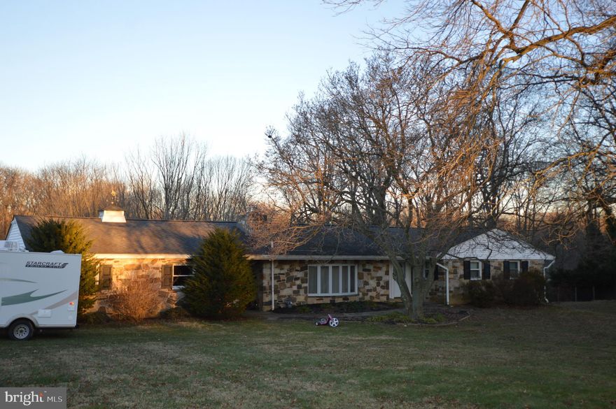3 Bedroom stone ranch situated on a beautiful lot and convenient to major commuter routes and great shopping. Entry foyer w/ tile flooring, large sunken LR features a beautiful stone surround gas fireplace. Living room and dining room have Pella bay windows for bright living areas. The eat-in kitchen features Corian counters, loads of cabinet space, ceramic tile backsplash, stainless refrigerator, dishwasher, ceramic tile flooring, and overlooks the tranquil backyard. The master bedroom has a walk-in closet and master bath w/ tile flooring. 2 additional bedrooms with nice closet space and w/w/carpet. Remodeled hall bath. Lower level is partially finished with bright sliders to patio and garden, utility room, work shop room, laundry room, 3rd bath w/whirlpool tub, and even a heated greenhouse. The backyard would be a great place for relaxation, a cookout, or an area to play. There is an oversized 2 car garage with plenty of storage space above garage as well. Energy efficient systems & central vacuum. This well-cared for home is a fantastic rental. Great area and Garnet Valley schools. Pets with landlords approval. Landlord has additional land next door if tenant needs space for a horse. Must have excellent credit.