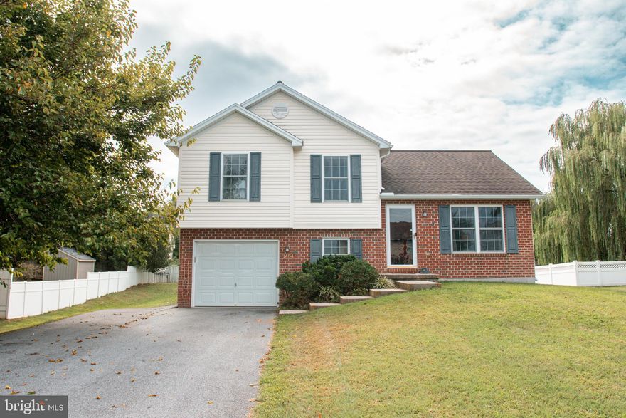 Welcome to this inviting split-level home that’s designed for everyday comfort and easy living. As you walk in, you’ll love the open kitchen and dining area filled with natural light—perfect for family meals, hosting friends, or just enjoying your morning coffee. The dining space opens right up to a roomy deck, making it a great spot for cookouts or simply relaxing outdoors. Upstairs, you’ll find three bedrooms, including a primary suite with a big walk-in closet to keep everything organized. The lower level adds even more flexibility with another bedroom that could be used as a guest room, home office, or playroom, plus a convenient laundry area and access to the attached garage. This home makes smart use of every inch, giving you plenty of space without feeling overwhelming. And with its great location close to local shops and amenities, it’s a place where comfort and convenience come together. Come see it for yourself—you might just find it’s the perfect fit!