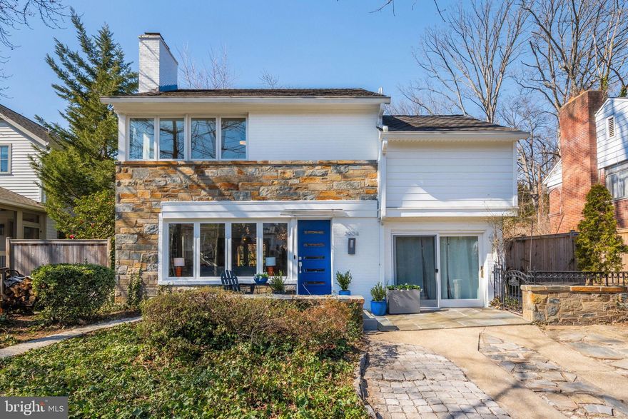 Nestled amidst mature trees and lush greenery, 2904 Russell Road in Alexandria, Virginia, exudes an earthy, organic charm. The original stone façade harmoniously blends with its natural surroundings, creating a serene retreat. Stepping through the vibrant blue door, you're welcomed into a spacious living room adorned with a striking stone wall and cozy fireplace, perfect for unwinding. Adjacent lies the dining room, leading to a sunroom that bathes the space in natural light—a tranquil haven to melt away the day's stresses while watching the sunset. The refurbished kitchen, featuring a wall of windows, invites nature indoors, offering a delightful spot to enjoy morning coffee while observing visiting birds from nearby Monticello Park. Conveniently located off the kitchen is a half bath, and just two steps down, a versatile office or TV room occupies the converted garage space.

Ascending the front stairs, you'll find three generously sized bedrooms and two bathrooms. The primary suite welcomes the morning sun through an extended corner window and boasts a recently renovated ensuite bathroom—a must-see! Two additional spacious bedrooms and a hall bathroom complete the upper level, with easy access to floored storage via a ladder/stair setup.

The unfinished basement houses laundry facilities, a work area, and ample storage space.

This home's location offers exceptional walkability. Del Ray's renowned restaurants, such as Taqueria Poblano and Piece Out, are just 0.6 miles away. A stroll up Beverly leads to Monticello Park, celebrated for its migrating warblers each April and May, and also features trails and a dog run area. Mom's Organic Market is a little over half a mile away, and the Del Ray farmers market is less than a mile from your doorstep.

For commuters, bus route 103 runs along Russell Road, the Potomac Yard Metro stop is under 2 miles away, and National Airport is a mere 2 miles, ensuring quick access to Washington, D.C., and Old Town Alexandria.

Important to note:
Updated Primary Bathroom, 2024
New HVAC, 2024
New Kitchen 2022
The current owner has lived and raised her family here for over 40 years. She has chosen to live pesticide free and chemical free while living here.