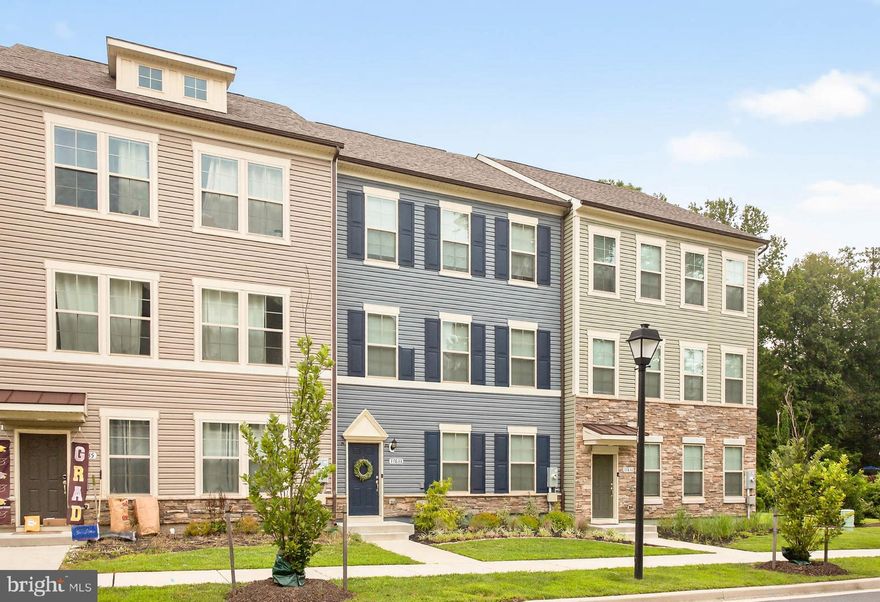 This beautifully maintained townhome offers a bright and open layout featuring a spacious kitchen with a center island and a dining area that flows seamlessly to a large private deck, perfect for entertaining or relaxing. Upstairs, the spacious primary bedroom features tray ceilings, a walk-in closet, and a private en suite bathroom for your comfort and convenience. The finished basement provides extra living space and direct access to the attached two-car garage. Conveniently located near Route 108 and New Hampshire Avenue, you’ll be just minutes from shopping, dining, parks, highways, and more. A great opportunity in a sought-after area.