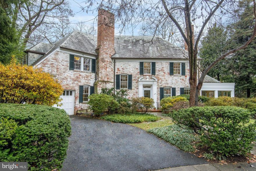 Stunning 1941 Whitewash Brick Colonial on cul-de-sac w/over 6,000 SF of living space throughout 4 sun filled levels. Gracious Entertaining Floor Plan that walks out to Main Level deck overlooking impressive, almost 16,000 SF lot w/ Pool. 2 upper levels have 5 Large Bedroom Suites - 4 on 2nd Level. Lower Level has casual entertaining space, BR Suite, Laundry, & Workshop. Garage.