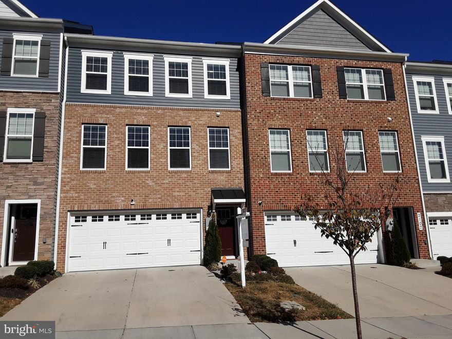 *** CONTACT AGENT TO SHOW - BACKUP OFFERS WELCOMED *** START THE NEW YEAR IN YOUR LIKE-NEW, BUILT 2022, TOWNHOME IN HIGHLY SOUGHT AFTER BOWIE! ASSUMABLE VA LOAN AT 4.75%!!! MAIN FEATURES Boast 4 Bedrooms, 3 Full Baths, and 1 Half Bath in Approx 2,872 Sqft of Three Levels of Living Space.  LOWER LEVEL Welcomes You Into a Foyer with a Crossover Staircase that Leads to a Spacious Family Room/Fourth Bedroom, Full Bath, Two-Car Garage, and Walkout Rear Exit. MAIN LEVEL Presents Oversized Open-Concept Living and Dining Rooms; Gourmet Kitchen Offers Beautiful Granite Counters, Abundance of Modern Cabinetry, and Huge Island w/Overlay for Barstool Seating; Outfitted with Stainless Steel Appliances, Five-Burner Stove, Built-in Microwave, and Eat-in Area/Den; Kitchen Opens to Sliding Glass Door to Deck for Outdoor Entertainment and Quality Family Time. A Dramatic Switchback Staircase Ushers You to the UPPER LEVEL Sleeping-Quarters Hosting a Large Primary Bedroom with Spacious Walk-in Closet and Large En-Suite Bathroom, Bright Second & Third Bedrooms,  Full Hall-Bath with Tiled Tub/Shower, and Convenient Large Upper Level Laundry Room. INTERIOR Accented with  Recess Lighting, Luxury Wood Flooring, Smart Home Features, Custom Blinds on Main & Upper Levels, Ample Space, and FRESH Paint Throughout. EXTERIOR Includes Front Porch Coverage from Weather Extremities, Keyless Entry System, Maintenance-Free Rear Deck, Front Load 2-Car Garage, and Driveway Parking for 2 Cars. NEARBY Shopping, Restaurants, & Parks at Woodmore Towne Center, Bowie Town Center, Watkins Park, Allen Pond Park, and Commuting Routes I- 495 & R-50 lead to Downtown DC, MD, & VA. FLOORPLANS w/dimensions in Photos.