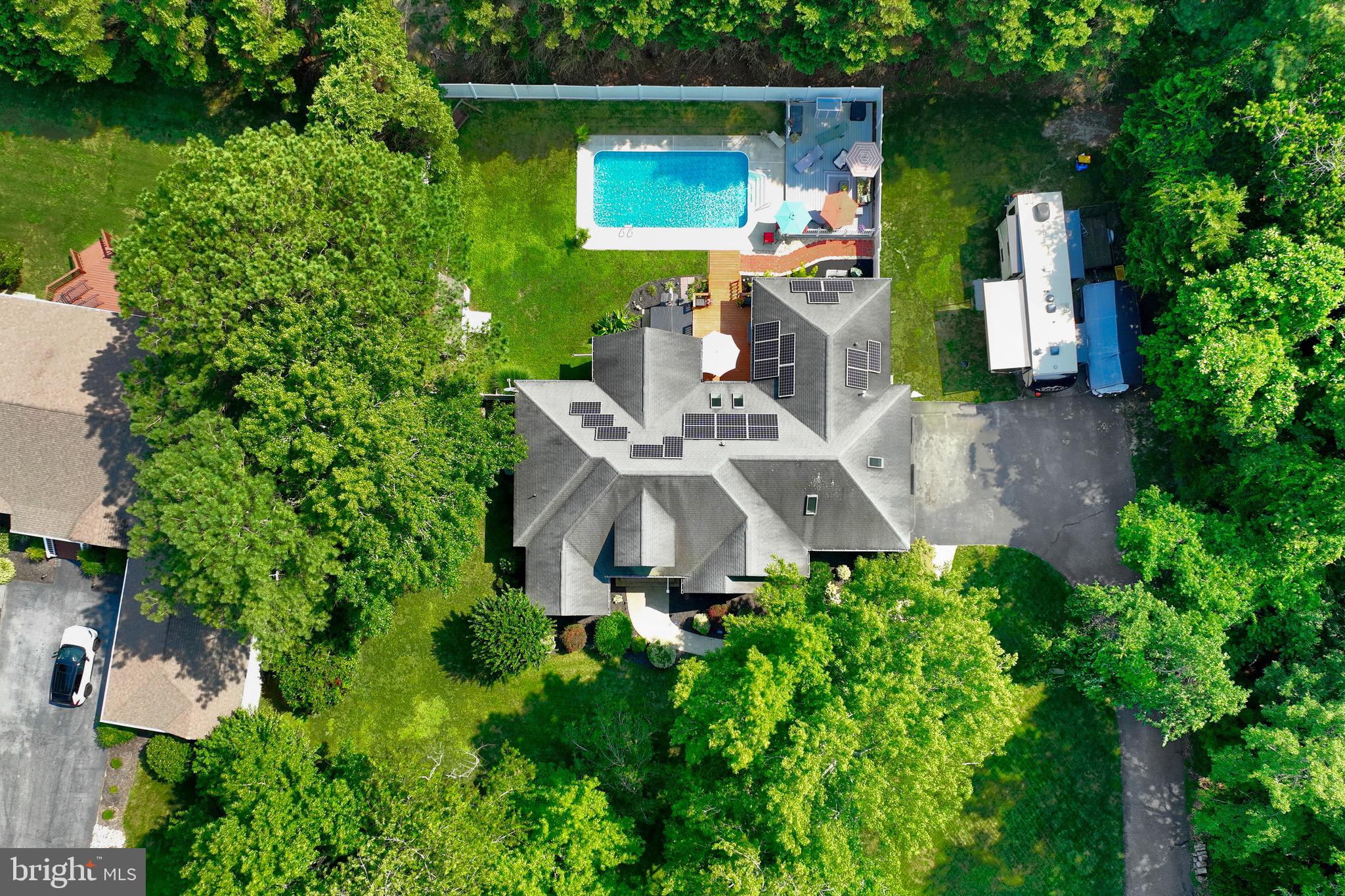 Lots of curb appeal welcomes you to 12002 Sunflower Court, a beautifully maintained brick and vinyl-sided contemporary home in the peaceful, tree-lined community of Piney Island. This spacious residence offers main-level living and many recent upgrades on over half an acre with a private in-ground pool.
Inside, you’ll find a spacious primary suite and upscale primary bath, two additional generously sized bedrooms, two and a half bathrooms, and a flexible open layout ideal for both everyday living and entertaining. Relax in the living room featuring a cozy gas fireplace or in the light-filled sunroom overlooking the pool. Additional space off the kitchen is perfect for a home office, music room, den, or library. The well-equipped kitchen features cherry wood cabinetry, granite counters, modern appliances, and a dedicated dining area.
Take the steps up to a very spacious bonus area perfect for a 4th bedroom, home office, game room, or workshop with additional large storage closet.
The beautiful outdoor living space features a private in-ground pool, complete with fencing for added safety—an ideal setup for relaxing summer days or hosting friends and family. The attached garage and driveway offer plenty of parking, and the property is enhanced by mature landscaping and irrigation.
With no HOA, solar panels, and a well and septic system in place, this home offers efficient living with added independence. Located just minutes from Ocean City and Fenwick Island, this property provides the charm and tranquility of a quiet community with easy access to beaches, shopping, and dining.
Don't miss your chance to own this serene retreat in one of the area's most desirable neighborhoods.