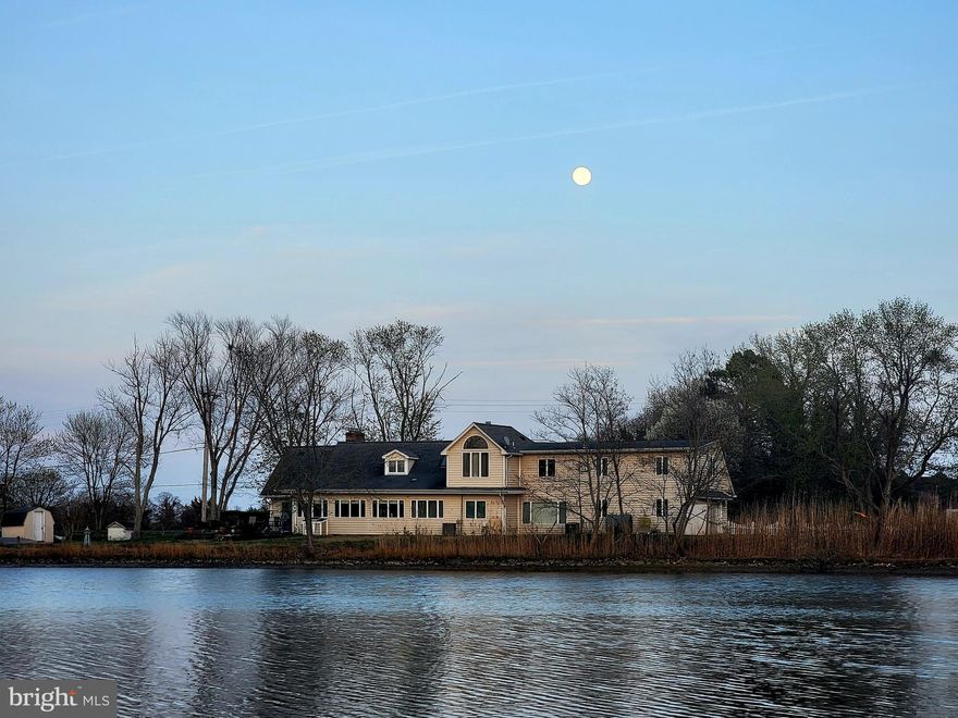 Are you finding yourself longing for a peace and quiet that only life on the water can bring?  Come home to stargazing without light pollution, dinner on the patio watching osprey, herons and geese in the creek. Spend your weekends boating, fishing, crabbing on the pier or taking long walks with both water and farm views. Invite your friends and family because this home has 6 bedrooms and 3 bathrooms with a floorplan perfect for a multi family living situation or even a vacation rental. The first floor living room is both cozy with the fireplace and also fun with the bar area and room to dance or game. You'll love the natural light coming into the kitchen with expansive windows bringing the creek views as close as you can get without stepping outside.  So much granite counter space especially with the mobile island, newer appliances, an undermount sink, appliance garage and desk space might just make this your favorite room of the house. Whether you're having elaborate formal meals or casual fare, the dining room seats as many as you want and a fireplace and amazing views to top it off.  Completing the main level are 2 spacious bedrooms, a full bath and laundry room with a 2nd shower.  You'll also appreciate the side entrance of the home that open to a large entryway currently used as a library that can double as an office with access to the 2nd level leading to another primary bedroom, ensuite bathroom with soaking tub and separate shower. Plus 3 additional bedrooms, 3rd full bath and common space where you'll discover the spiral staircase taking you back to the lower living room.  Plenty of parking with 2 paved driveways, a sideload attached garage and 2nd single car garage/shed plus another shed for storage. The covered front porch brings you panoramic views of a farm and woods where wildlife roam.  The side and backyard have unobstructed views of St. Jerome Creek where you can dock your boat or launch your kayak with easy quick access to the Chesapeake Bay.  Ridge is just far enough away from the hustle and bustle but still close enough to shopping and commuting.  Locally you'll enjoy the waterfront restaurants, farmstands and state park. Just a few minutes to historic St. Marys City and St. Marys College.