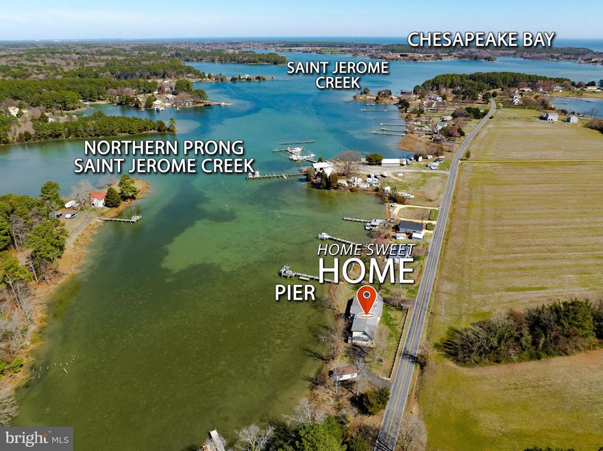 Are you finding yourself longing for a peace and quiet that only life on the water can bring?  Come home to stargazing without light pollution, dinner on the patio watching osprey, herons and geese in the creek. Spend your weekends boating, fishing, crabbing on the pier or taking long walks with both water and farm views. Invite your friends and family because this home has 6 bedrooms and 3 bathrooms with a floorplan perfect for a multi family living situation or even a vacation rental. The first floor living room is both cozy with the fireplace and also fun with the bar area and room to dance or game. You'll love the natural light coming into the kitchen with expansive windows bringing the creek views as close as you can get without stepping outside.  So much granite counter space especially with the mobile island, newer appliances, an undermount sink, appliance garage and desk space might just make this your favorite room of the house. Whether you're having elaborate formal meals or casual fare, the dining room seats as many as you want and a fireplace and amazing views to top it off.  Completing the main level are 2 spacious bedrooms, a full bath and laundry room with a 2nd shower.  You'll also appreciate the side entrance of the home that open to a large entryway currently used as a library that can double as an office with access to the 2nd level leading to another primary bedroom, ensuite bathroom with soaking tub and separate shower. Plus 3 additional bedrooms, 3rd full bath and common space where you'll discover the spiral staircase taking you back to the lower living room.  Plenty of parking with 2 paved driveways, a sideload attached garage and 2nd single car garage/shed plus another shed for storage. The covered front porch brings you panoramic views of a farm and woods where wildlife roam.  The side and backyard have unobstructed views of St. Jerome Creek where you can dock your boat or launch your kayak with easy quick access to the Chesapeake Bay.  Ridge is just far enough away from the hustle and bustle but still close enough to shopping and commuting.  Locally you'll enjoy the waterfront restaurants, farmstands and state park. Just a few minutes to historic St. Marys City and St. Marys College.