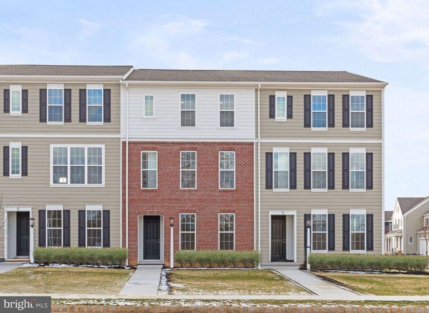 Perched along the neighborhood green, this move-in ready luxury townhome combines timeless charm with modern elegance—and it’s ready for you to make it your own. Step inside to  9' ceilings and rich Luxury Vinyl Plank flooring throughout the main level. Natural light pours into the open-concept great room, dining area, and chef-inspired kitchen—perfect for both lively gatherings and quiet evenings. The front study offers a private retreat, while the kitchen wows with an oversized eat-in island, prep island, stainless steel appliances, granite countertops, designer tile backsplash, and our sought-after Almond stain cabinetry. Upstairs, unwind in the serene primary suite with a spa-like en-suite bath and walk-in closet. Two additional bedrooms and a full bath provide ample space for family or guests. The finished lower-level game room is ready for movie marathons, workouts, or weekend fun. Outside, a classic partial brick façade and thoughtfully landscaped entry create undeniable curb appeal, while expansive green space right out front invites outdoor living. Located in the sought-after Cumberland Valley School District, Grange blends small-town charm with luxury finishes. Move in before the end of the year and start living your dream. Nestled in the heart of the Cumberland Valley, Grange features preserved spaces including a wildflower meadow, green areas shaded by century-old trees, walking trails, and gathering spots perfect for connecting with friends old and new.