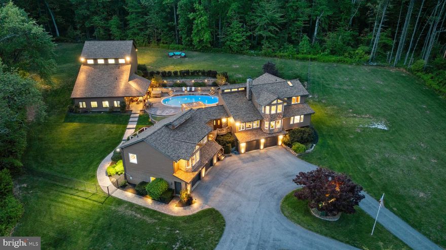 Secluded Estate surrounded by nature situated on 3 acres. Heated Saltwater Pool and 4-Car Garage.

Nestled at the end of a quiet, no-through street, this beautifully secluded estate offers a rare combination of luxury and complete privacy across three acres that is partially fenced. The property includes a beautifully designed main home with 4,400 square feet, along with a separate 1,865 square foot Pool House that can easily be converted into a guest house, totaling 6,298 square feet of living space. Ideal for in-laws, extended stays, visitors, or additional workspace, the poo house/guest house offers flexibility to suit your lifestyle.

The main house features a show-stopping kitchen with a generous 14' x 5' island, butler’s pantry, and high-end finishes throughout. Vaulted and cathedral ceilings create a spacious, open feel with an abundance of light.

 Main floor you’ll find generously sized bedrooms with large walk-in closets. Two bedrooms share a Jack and Jill bathroom, while two others have private ensuite bathrooms. The Master Suite is located on the second floor and is the only bedroom on that level. The lower level includes several finished rooms originally designed as offices, but easily adaptable to your needs.

Outside, enjoy a heated saltwater pool complete with a waterfall and new hot tub, perfect for relaxing or entertaining. Recent upgrades include new roof on main house and pool house 2023, 58 new windows 2022, a new pool pump, two Mitsubishi mini-split units, two new hot water heaters, two 1,000-gallon underground propane tanks, and two whole house Cummings Onan generators.

With a four-car garage, pool house/guest house, and a peaceful setting surrounded by nature, this home offers space, comfort, and complete privacy, all with refined style.