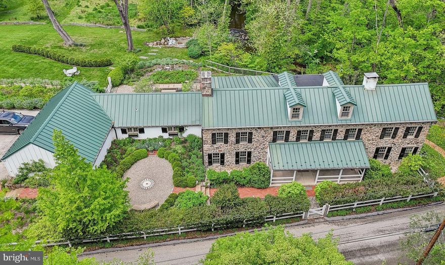 Introducing Mill House Farm- a thoughtfully restored and completely renovated 5 bedroom, 2.5 bathroom home that sits on a breath taking 3.8 acre lot. Under the guidance of Archer and Buchanan and the detailed work of Rittenhouse Builders, a whole house renovation was completed to sensitively restore and enhance the historic character of the house. Extensive historical research was done so that it remained true to keeping with it’s Okie design & the 19th century, while still updating it for modern living. The addition of the kitchen, mudroom, and laundry area was purposely kept to scale of the existing house so not to overwhelm the original historic structure while also allowing for an effortless flow. Just a few of the architectural details include reclaimed, antique period mantels; antique restored ceiling lighting and custom antique replica lighting; antique hardware or replica hardware; reclaimed doors; and custom cabinetry throughout. Some of the modern amenities featured include a gourmet kitchen with radiant floor heating, soapstone counters, Viking Appliances, custom inset cabinetry, and attached breakfast room; heated floors in second floor bathrooms- both completely updated; central air added; whole house generator; and first floor laundry. There is even a finished third floor that could be used as a play room or office. The unbelievable exterior is not to be missed with a covered porch that overlooks scenic Darby Creek and the multiple organic gardens and lily pond courtesy of Wallace Landscaping Associates. Antique millstone in the front garden gives nod to it’s Mill House origin while the thoughtful native plantings add to the biodiversity of the gardens. The back half of the property offers great space for play equipment and fun and even has a zip line that connects you from one end to the other. To the left of the driveway there is vegetable gardens, a chicken coop and a shed that is currently used as a work-out space with heat and wifi. All of this while being minutes to some of the best private academies in the country including Episcopal Academy, Agnes Irwin, and Academy of Notre Dame; close to Downtown Wayne; and easy access to all major roadways and Paoli Train Station. Call today to see this magnificent property. It is truly one-of-a-kind!