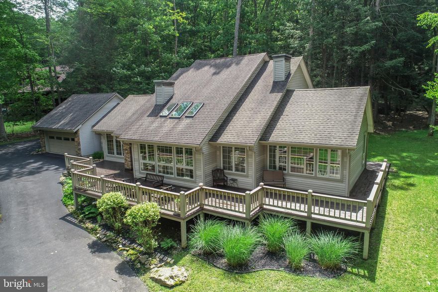 Located in the scenic Deep Creek Lake area, this well-kept 4-bedroom home offers comfort, space, and convenience with filtered lake views and a functional layout that allows for one-level living if desired. Sold turn key and situated on a generous lot, the property features an oversized front and back yard, ideal for outdoor enjoyment, along with a large wrap-around paved driveway and an attached 2-car garage. Inside, the home has been thoughtfully maintained with several upgraded systems including a newer furnace, updated sliding glass doors, and more. The two-level design provides flexibility for families or guests, while the spacious layout ensures room to relax and entertain. Whether you're seeking a full-time residence, a vacation getaway, or an investment opportunity near Deep Creek Lake, this property combines quality, location, and value in one impressive package. Enjoy peaceful surroundings with easy access to lake activities, dining, shopping, and all area amenities.