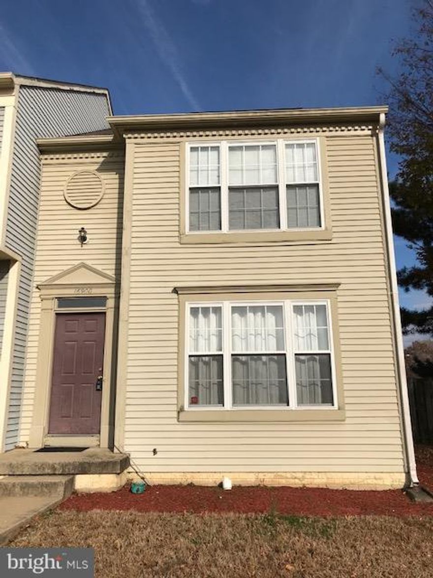 Spacious End Unit Townhome.  Nice deck. 3.5 Baths. Hardwood Floors.  Freshly painted and renovated.  Bonus room in the basement.  Door and Stove to be replaced.