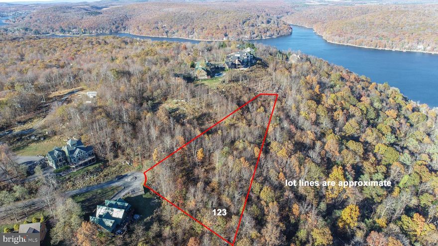 One of the best lake view lots at Deep Creek Lake! Big mountain and water views from this 1.67 acre homesite in the private community of Mountainside. Lake access with public sewer available. This lot sits at the top of the ridge with quiet surroundings, yet still close to Wisp Resort, marinas, restaurants, and local establishments. Mountainside offers a private marina club, tennis and basketball courts, and walking paths throughout. If you want a premier lake view property with privacy, space, and easy access to all the lake has to offer, this one checks all the boxes. Call for details.