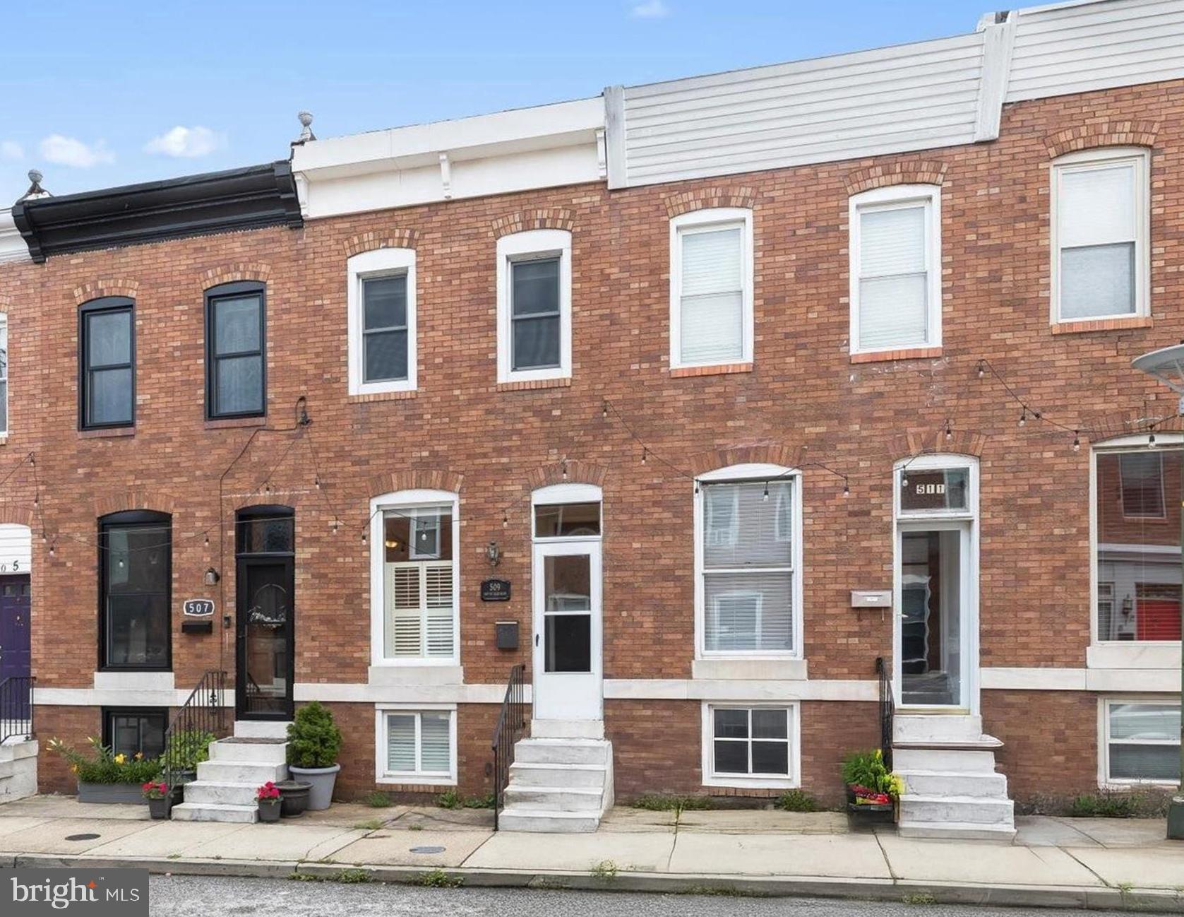 Nestled in the vibrant Canton neighborhood of downtown Baltimore, 509 S Robinson Street offers the perfect blend of classic charm and modern sophistication. Step into the open concept living and dining area, where hardwood floors and timeless moldings set a warm, welcoming tone. The stylish eat-in kitchen boasts sleek stainless steel appliances, granite countertops, decorative backsplash, ample cabinetry, and direct access to the rear parking pad ideal for city living. Upstairs, two spacious bedrooms with hardwood flooring share a well-appointed full bath. The finished lower level adds valuable living space with a cozy family room, a convenient powder room, laundry area, and generous storage. Just moments from Patterson Park, M&T Bank Stadium, Camden Yards, and the Shops at Canton Crossing, with easy access to I-695, I-895, I-83, and I-95, this home offers the best of Baltimore living with unbeatable convenience.