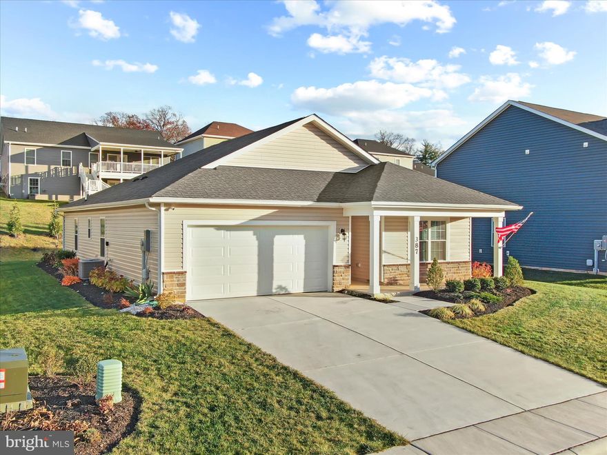 Price Reduced!  Looking for a 4-bed single family home in Martinsburg under $400K? This move-in ready rambler offers thoughtful upgrades, open concept living, and unbeatable value in Red Hill. Built in 2023, this 1,698 sq ft home blends modern efficiency with traditional comfort, all set on a professionally landscaped 7,918 sq ft lot.
Step inside to a light-filled open floor plan perfect for entertaining. The kitchen features a large granite island, stainless steel energy-efficient appliances, and luxury vinyl plank flooring that runs throughout the main living areas. The spacious family room flows easily to a 12x20 patio, ideal for outdoor gatherings.
The split-bedroom layout ensures privacy, with four bedrooms and two full baths offering flexibility for guests, work-from-home needs, or growing households. The primary suite includes a full bath and walk-in closet.
A charming front porch with stone accents adds curb appeal, while the two-car garage offers ample storage. Low annual HOA fee of $158 and location in the desirable Red Hill community make this a smart and affordable choice.
Conveniently located near commuter routes, schools, and local shopping. Whether you're upsizing, downsizing, or relocating, this Martinsburg gem delivers both style and practicality.