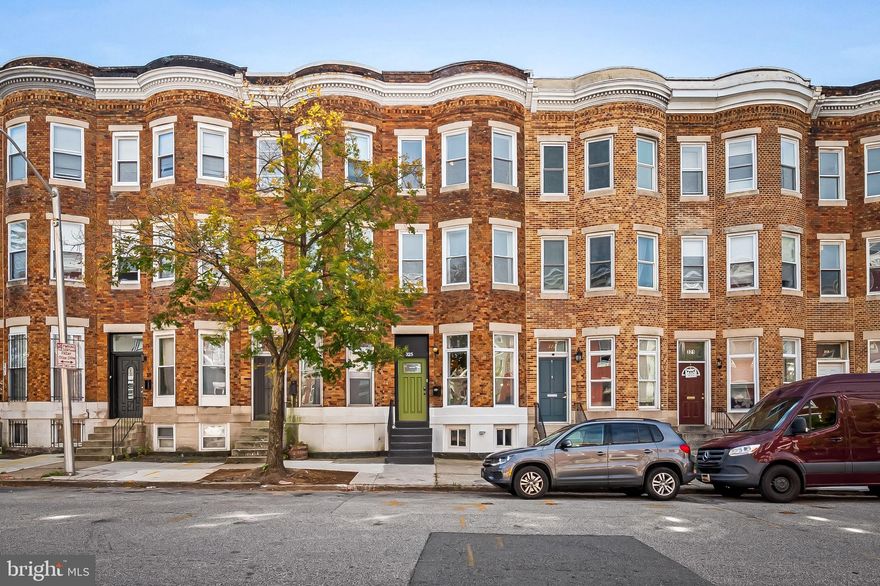 Handsome townhouse in Baltimore’s historic Old Goucher/Barclay neighborhood, surrounded by some of the city’s most celebrated restaurants and gathering spots — Clavel, WC Harlan, Fadensonnen, Sophomore Coffee, and Mama Koko’s are all just around the corner. Enjoy the ultimate in city convenience with Penn Station within walking distance — hop the Amtrak to New York or Philadelphia, or the MARC train to Washington, D.C.
This home has been meticulously designed and maintained, featuring soaring ceilings on every level and a layout that feels both grand and welcoming. The main level offers a spacious living room with floor-to-ceiling windows, a chef’s kitchen perfect for creative cooking, and a large dining area ideal for seamless entertaining.
Upstairs, the second floor features a serene primary suite with a private en-suite bath, along with two additional bedrooms and a full hall bath. The third floor adds two more bedrooms and another full bath, providing exceptional flexibility for guests, work, or hobbies.
Out back, a large fenced garden and two-car parking pad complete the package — perfect for entertaining, gardening, or simply relaxing with a good book and a glass of wine.
Experience timeless architecture, thoughtful design, and unbeatable walkability — all at 325 E. 22nd Street.