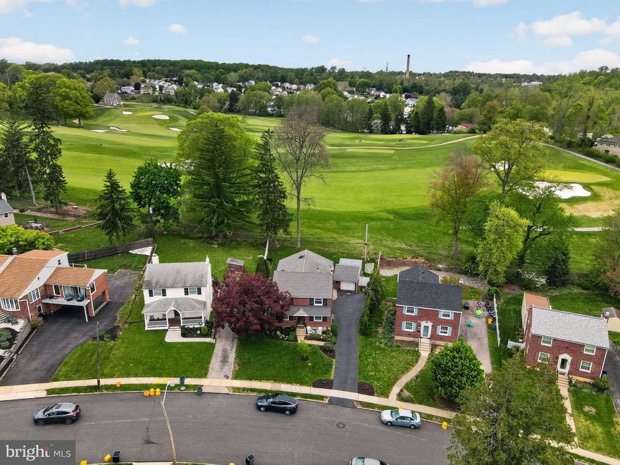 Welcome to 578 Rutherford Road, nestled in the highly sought-after Rolling Green section of Springfield Township and located within the award-winning Springfield School District. This beautifully expanded and renovated four-bedroom, two-and-a-half-bath home offers an exceptional blend of elegance, comfort, and modern convenience—perfectly positioned with scenic views backing to the 11th hole of Rolling Green Golf Club.
From the moment you arrive, the newly finished driveway and meticulously maintained exterior reflect true pride of ownership. Step through the brand-new front door and into a refined interior featuring gleaming hardwood floors, custom paneled walls, and thoughtfully curated finishes throughout.
The formal living room offers a warm and inviting space, while the tastefully appointed dining room showcases abundant built-ins and elegant plantation shutters, ideal for both everyday living and entertaining. The sun-drenched family room serves as the heart of the home, centered around a cozy fireplace and offering direct access to the expansive rear deck—complete with a brand-new retractable awning and picturesque golf course views.
Adjacent to the family room is a stunning, fully redesigned open-concept kitchen that seamlessly combines style and functionality. This chef’s dream features a high-end gas range, additional wall oven, granite countertops, stainless steel appliances, a large center island, upgraded cabinetry, and generous storage, including a spacious pantry.
A versatile first-floor office or homework room with built-in lockers adds convenience and organization, along with a well-appointed powder room completing the main level.
The finished lower level provides expansive additional living space, offering two separate areas ideal for a media room, game room, home gym, or flexible use to suit your lifestyle.
Upstairs, the spacious primary suite features a large walk-in closet and a beautifully updated en-suite bath with a multi-jet shower, double sinks, and a rich walnut vanity. Three additional generously sized bedrooms with ample closet space share a brand-new hall bath with stylish tile, updated fixtures, and modern finishes. A second-floor laundry area adds everyday ease.
The outdoor space is equally impressive, highlighted by a new deck with a remote-controlled retractable awning—perfect for relaxing or entertaining while enjoying serene golf course views, new trees planted along the driveway. A detached two-car garage includes a built-in bar, creating a unique and inviting setting for outdoor gatherings.
Additional upgrades include newly completed brick pointing and the installation of a whole-house generator, providing peace of mind and long-term value.
This exceptional home offers a rare opportunity to enjoy refined living in one of Springfield Township’s most desirable neighborhoods.