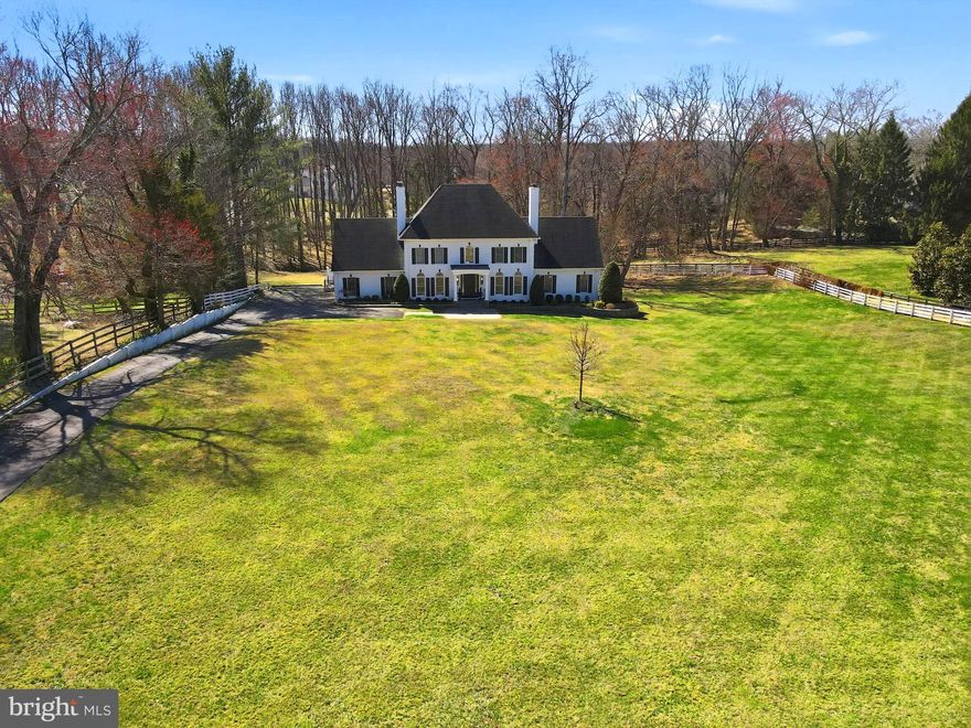 Welcome to 310 Springvale Road, Great Falls, Virginia — a fully renovated, four-level brick estate set on 2.6 private acres in the coveted Langley High School pyramid.
This impressive 4 side brick residence has been thoughtfully updated from top to bottom with high-end finishes and designer touches throughout. The sun-drenched main level showcases soaring windows, expansive ceiling heights, and refined living spaces anchored by gas fireplaces, creating warmth and architectural interest across multiple levels. A dedicated main-level home office offers the perfect private workspace, while the main-level primary suite provides exceptional convenience with a beautifully renovated, spa-inspired bath and serene views of the grounds.
The chef’s kitchen is appointed with premium, high-end appliances, custom cabinetry, and elegant finishes designed for both everyday living and elevated entertaining. 
Upstairs, you’ll find four generously sized bedrooms — two with private ensuite baths, and two connected by a well-appointed Jack and Jill bath — offering comfort and flexibility for family and guests alike.
The fully finished lower level expands the living space even further with a second kitchen, full bedroom and full bath, ideal for guests or extended stays, along with a private gym featuring its own sauna for a true at-home wellness experience.
A rare fourth-level retreat provides a flexible private library or recreation room, perfect for quiet work, study, or relaxation.
Outdoor living is equally impressive. An expansive deck overlooks the flat, fenced, and exceptionally private yard, framed by mature landscaping across 2.6 acres — lush lawn leads to beautiful trees, ideal for entertaining, play, or peaceful enjoyment.
Located in one of Great Falls’ most desirable settings and within the highly sought-after Langley School District, this turnkey estate offers luxury, privacy, and space — all just minutes from Tysons, major commuter routes, and Washington, D.C.

An exceptional opportunity to own a meticulously renovated estate in one of Northern Virginia’s premier communities.