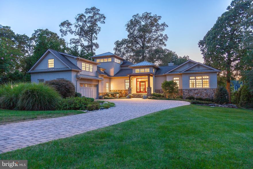 $200K Price reduction for the Fall 2023 market! Welcome to 1848 Milvale located in the Saint Margarets area of Annapolis.  As you enter the home you are struck by the beautiful wide views of Mill Creek, the open floor plan, and architectural details. The dining room and living room have gorgeous coffered ceilings,  cherry hardwood floors, extensive millwork,  floor-to-ceiling windows, and French doors that overlook the saltwater pool, spa, and creek.  The kitchen offers a huge central island, wolf range, and custom cabinetry.  Off the kitchen is the family room...  it's striking with its vaulted barrel ceiling, custom built-ins, bar area, gas fireplace, and curved bank of windows centering again on the views of Mill Creek. The home has 2 main-floor bedroom suites with attached baths. The waterside bedroom has a poolside door and views of the creek while the front bedroom has serene views of the cornfields across the road facing East. One of the architectural highlights of the home is the stairwell tower with its impressive wide girth access to two distinct upper-level areas.  Flooded with light, the high ceiling with clerestory windows first lands at the hall library-study. This cozy nook opens to a multi-purpose suite that can be used as a 3rd bedroom,  a nursery, a 2nd family room, or an often-needed teen hangout area. The tower takes a turn to the left and accesses the primary bedroom and adjoining waterside office. The primary bedroom provides his and her walk-in closets, a huge spa bath with a soaking tub, heated floors, a walk-in shower, and laundry.  Off of the primary bedroom is a handsome office with custom cabinets, a gas fireplace, and a deck to enjoy your morning coffee or a sunset cocktail.  The lower level is the fifth-bedroom suite. This room is both the seller's workout room and wine cellar.  The utility room has a wash sink, great for gardening, and houses the water treatment systems and  2 Geo-Thermal systems.  The home has beautiful hardscaping with irrigation, and a rock garden water feature in the front of the home, and in the back, there is 148 ft of water frontage with a handsome Belgium stone seawall. The pier is "like new" with 2 slips, a 15,000 lb. boat lift, and 8 MLW.  The pier is in a NO WAKE ZONE on weekends .. Located on one of the most sought-after roads in Annapolis and known for its privacy and country-like living, Milvale Road winds along the banks of Mill Creek in Saint Margarets surrounded by farmland and corn fields. A perfect place to unwind and enjoy the best sunsets around! See the Virtual Tour Video Icon at top of page    Floor plans are available online