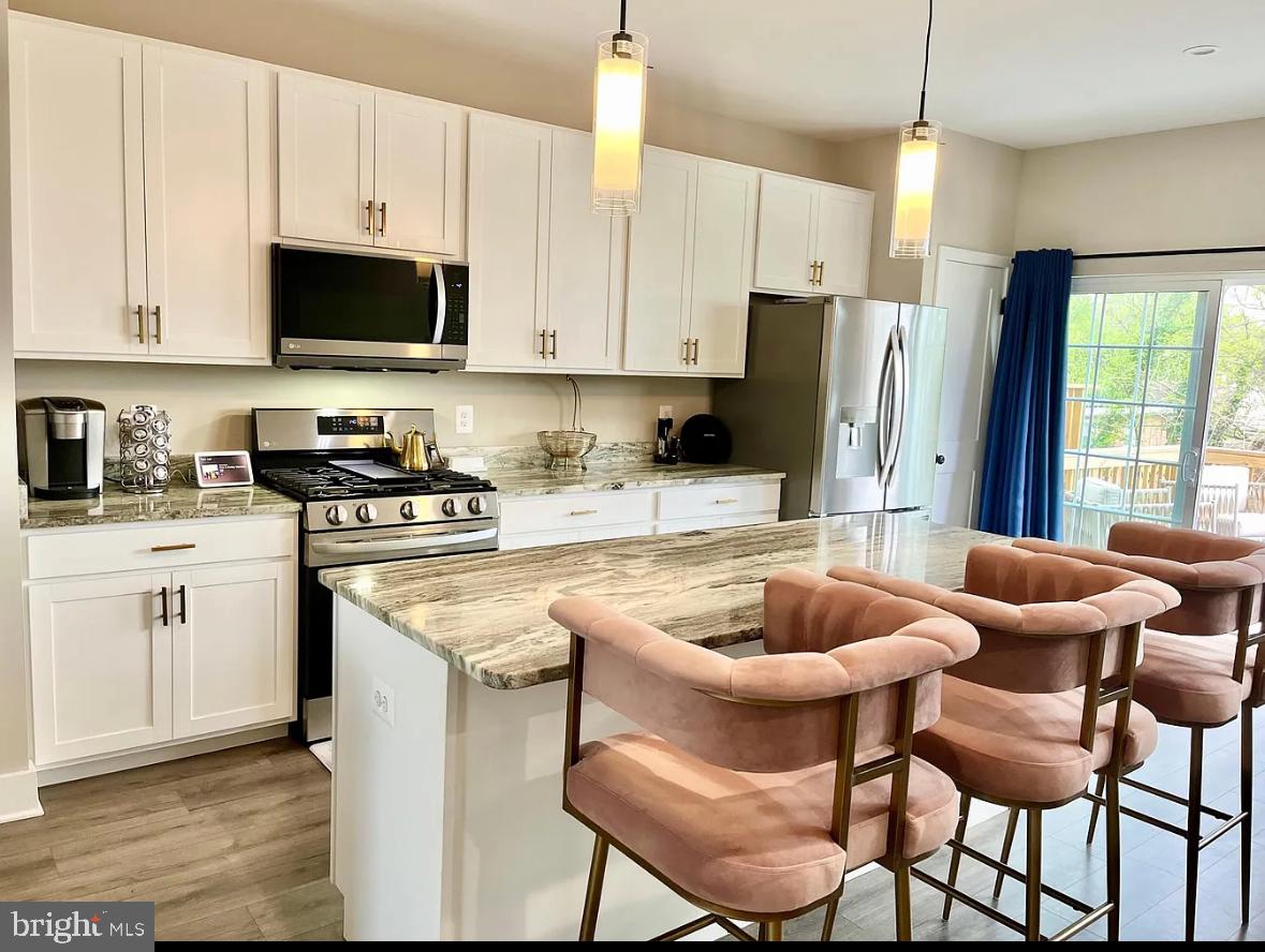 Sun-Filled & Modern Townhome Just Minutes from DC!
Welcome home to this spacious 3-level townhome in the sought-after Columbia Run community. Built in 2022, this property offers the perfect blend of modern comfort and convenience.
Step inside to find beautiful flooring leading into an open-concept main level with a bright living area and a chef’s kitchen featuring granite countertops, stainless steel appliances, a gas range, a large center island, and a dedicated dining space — perfect for everyday living and entertaining.
Upstairs, retreat to the owner’s suite with walk-in closet and private en suite bath. Two additional bedrooms, a full bath, and a laundry closet complete the top level. The entry level features a flexible den (ideal as a guest space, home office, or gym) with its own full bath and direct access to the backyard.
Enjoy parking ease with a garage, driveway, and additional street parking right in front.
This smart-home is equipped with:
Ring doorbell & optional monitored alarm system
Smart garage door opener
Smart LG appliances
Conveniently located just steps from Washington, DC, National Harbor, major commuter routes, and shopping, this townhome puts you close to it all.
No smoking. Available now.
