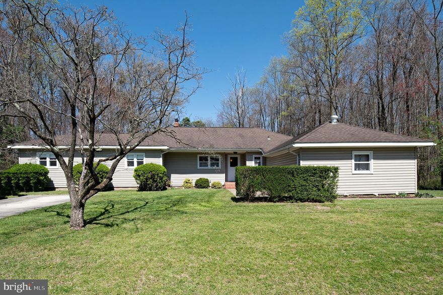 A rare find indeed you will love this 2,000+ square foot (all on 1 level) rancher resting on a .68-acre lot! This home is tucked away in a community where you will feel removed from the hustle and bustle but be just minutes from shopping and entertainment. You will also enjoy the convenience to BWI Airport, Ft. Meade and major commuting routes. Once inside, spread out in the spacious living room where you are just steps from the 11 x 22 sunroom offering a peaceful view of the rear yard. All three bedrooms are a fair size and there are 2 full baths. Special features include a heat pump system with oil as a back-up, wood burning fireplace, hardwood floors, lots of closet space and built-ins, a 14 x 19 laundry/storage room, formal dining room, double pane windows and more. If you need additional storage or like to tinker, there is plenty of room in the +-20 x 30 square foot shed/workshop! You'll want to see this home ASAP!