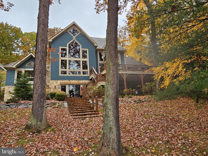 2 Lakefront homes! Amazing views throughout and both homes are steps to the lake. There are endless possibilities. Have all of your friends and family with you and make good memories that will last a lifetime.  Or rent out the large home and make some money. Check out the rental projection!! With 190 feet of lake front and a brand-new type A dock you will feel like you are at! your own little oasis. The main house has 6 bedrooms and 4 of them are suites. It also has brand new furniture throughout! The smaller home has 2 bedrooms and a loft with amazing views! Did I mention no HOA. There are great views from both homes!! Why buy 1 home when you can get 2??