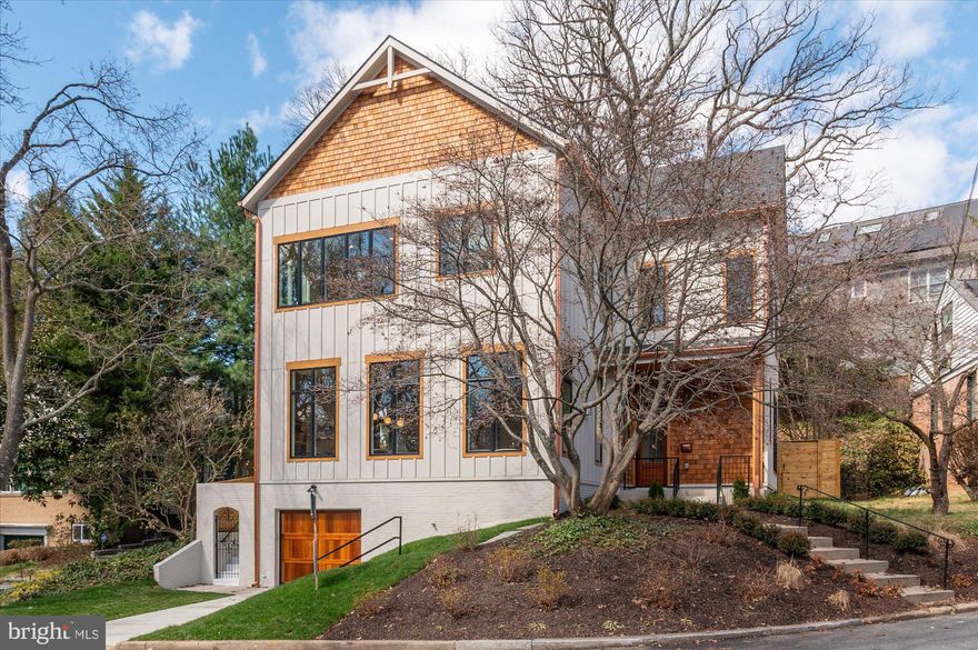 This stunning, newly constructed single-family home is a masterpiece of design and craftsmanship, bathed in natural light and offering captivating views. Thoughtfully built with meticulous attention to detail, it features a spacious open floor plan highlighted by soaring 12-foot ceilings, wide-plank oak flooring, and tall, solid-core wood doors!

The open gourmet kitchen is a showstopper, boasting custom cabinetry, Taj Mahal quartzite countertops, premium Wolf appliances, and a separate wet bar perfect for entertaining. The luxurious master bathroom showcases an onyx ceramic slab, creating a spa-like retreat. Pella windows flood the home with light, enhancing its warm and inviting ambiance.

On the main level, you'll find a versatile hybrid room that can serve as a home office or bedroom, a full bath, and a generously sized recreation room in the basement. The main level also adjoins a cozy family room with a gas fireplace—ideal for relaxing evenings. On the upper level, you will find four generous-sized rooms, including an impressive primary suite designed to be your personal sanctuary.

Located in a quiet cul-de-sac, this home features a one-car garage and is perfectly situated within walking distance of Palisades' charming restaurants, shops, the Capital Crescent Trail, and the C&O Canal. Despite its serene neighborhood setting, it’s just a short drive to downtown DC, offering the perfect balance of tranquility and accessibility.