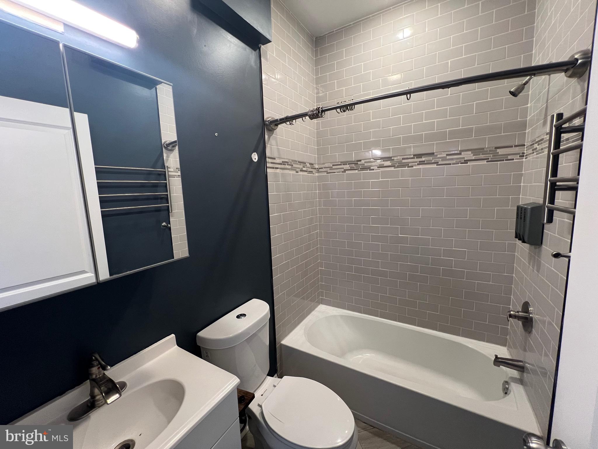 Welcome to 1829 N 33rd St Unit 2R, a thoughtfully designed 1-bedroom, 1-bathroom apartment where creativity and comfort meet. The bedroom features a stylish accent wall, adding a modern touch to the space, while the bathroom showcases beautifully arranged tile for a polished finish. The cozy living area flows seamlessly into a sleek kitchen with stainless steel appliances, and large closets provide plenty of storage. With the added convenience of an in-unit washer and dryer, this home offers both functionality and style in a space you’ll love coming home to.