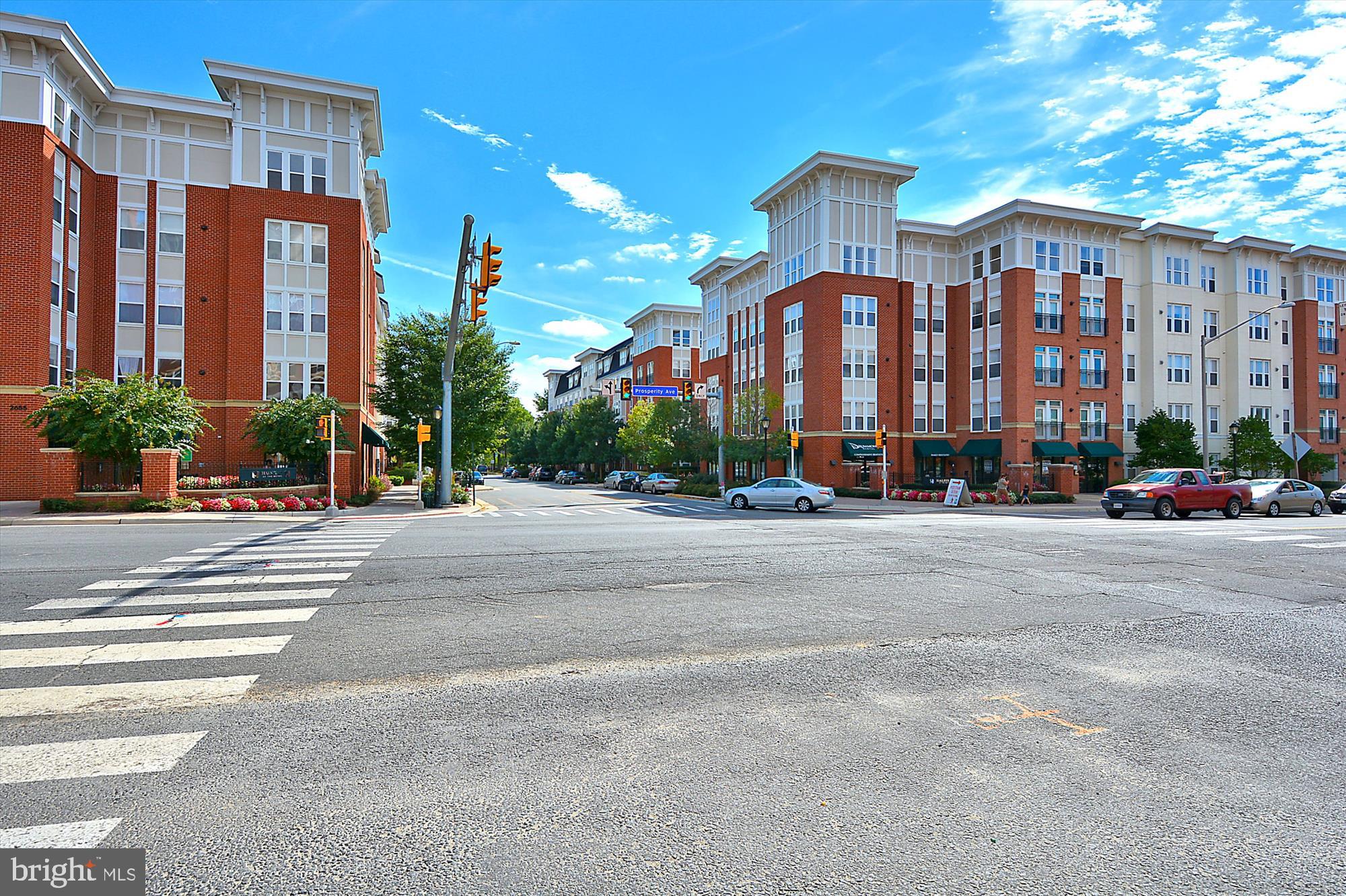 Welcome to this light-filled and meticulously maintained 2-bedroom, 1-bath condo in the highly desirable Halstead at the Metro community. This spacious unit offers a modern open floor plan with a seamless flow between the living, dining, and kitchen areas—perfect for everyday living and entertaining. The updated kitchen features stainless steel appliances, granite countertops, ample cabinet space, and a breakfast bar for casual dining. The bright living room opens to a private balcony, providing a peaceful outdoor retreat. A full-size washer and dryer in-unit adds convenience and ease. Enjoy two assigned garage parking spaces and access to resort-style amenities including a swimming pool, fitness center, clubhouse, and beautifully landscaped grounds. Condo fee includes water, trash removal, exterior building maintenance, and access to all amenities. Location is everything—enjoy being just steps from the Dunn Loring-Merrifield Metro Station, making commuting into D.C. or across Northern Virginia a breeze. You're also within walking distance to the vibrant Mosaic District, home to award-winning restaurants, shops, a movie theater, coffee spots, farmers markets, and community events. Minutes from Tysons Corner, INOVA Fairfax Hospital, and major commuter routes including I-66, I-495, Gallows Rd, and Route 50—this location offers unbeatable access to everything the region has to offer. Must see!