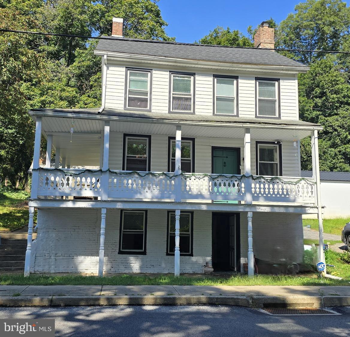 Exceptional Victorian Charm in Seven Valleys
Step into 108 S Main Street, a beautifully restored Victorian offering 1,828 square feet of turn-key living on a .27-acre corner lot. Fully updated in 2024, this 3-bedroom, 1.5-bath home combines historic elegance with today’s must-have finishes and sits just minutes from I-83.
Inside, a welcoming wrap-around porch leads to original hardwood floors, soaring ceilings and a wood-burning fireplace anchoring the living room. The gourmet kitchen shines with granite counters, stainless-steel appliances and custom cabinetry, while the formal dining room—complete with wainscoting and chandelier—sets the stage for memorable gatherings. A chic powder room on the main level adds everyday convenience.
Upstairs the primary suite and guest bedroom feature generous closets, and the luxury bath impresses with double vanities and a ceramic tile shower. A vaulted bonus room adapts easily as a home office or play space. Two additional finished rooms in the walkout lower level are ideal for media, fitness or hobbies.
Outside, entertain on the covered rear porch or freestanding deck, store tools in the oversized detached garage and tackle projects in the wired summerhouse workshop. With a new roof, energy-efficient windows.
Nestled near Brown’s Orchards, Loganville and Glen Rock, this rare find in small-town Seven Valleys won’t last. Schedule your private showing today and make your highest offer on 108 S Main Street.