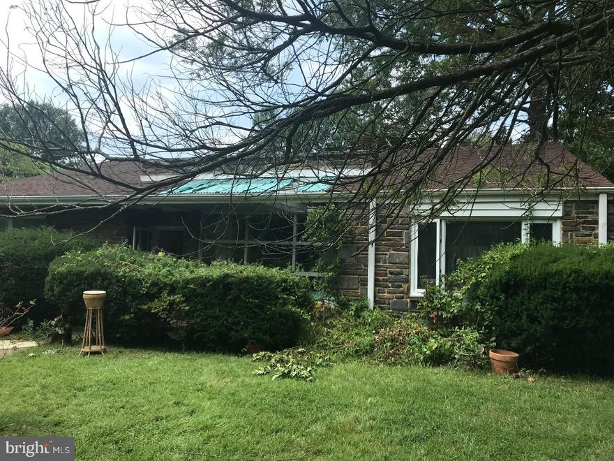 Fantastic opportunity to own a single family home on a large corner lot in Mt. Airy.  With some imagination and TLC, this 4 bedroom and 2 full bath ranch would provide ease of living on a single floor.  The open and bright living room features a wall of windows opposite a dramatic wood burning stone fireplace. To the right is a generous dining room with the kitchen and laundry / mud room beyond.  A large bedroom, previously used as a den / office with attic access is also located off of the dining room. On the other side of the home is the main bedroom with a full, en suite bathroom.  2 additional bedrooms flank another full bathroom. This home also allows for the potential transformation of an attic space into a loft area.  The 2 car garage and private driveway offer even more privacy on the quiet street.  Conveniently located near the train and all of the shops and restaurants Mt. Airy and Chestnut Hill have to offer.  Showings begin Saturday, August 11, 2018.  Offers should be submitted by Tuesday, August 14, 2018 at 4:00pm.  Offers will be reviewed on Wednesday, August 15, 2018.