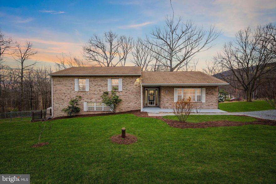 Nestled on a serene corner lot, this stunning brick split-level home offers the perfect blend of sophistication and comfort within an engaging and vibrant community . Step inside and prepare to be amazed by the thoughtful upgrades and elegant touches throughout.
The main living area welcomes you with vaulted ceilings, bathed in natural light streaming through large windows that frame picturesque views of the surrounding landscape. Gather around the gas fireplace, adding warmth and ambiance to the room, creating a cozy atmosphere for relaxing evenings with loved ones. The heart of the home, the kitchen, is a chef's delight featuring sleek quartz countertops, stainless steel appliances, and a convenient bonus working area. Wainscoting adds a touch of charm and character, creating a warm and inviting space for culinary creations and gatherings with loved ones.
Escape to the lavish primary suite boasting vaulted ceilings and barn doors that lead into a massive walk-in closet, offering ample storage for all your wardrobe essentials. Pamper yourself in the luxurious en suite bath complete with tile flooring, a relaxing soaking jacuzzi tub, and a tiled shower with a custom niche, providing the ultimate spa-like experience right at home.
Entertainment abounds in the lower level, where an oversized multimedia room awaits movie nights and gatherings. Need a quiet retreat? The fourth room with built-ins and a private deck offers the perfect space for relaxation or productivity, ensuring everyone in the household has their own slice of paradise. Step outside to explore the amenities of this enchanting community, including a shimmering lake with a sandy beach for sun-soaked days of relaxation, playgrounds for endless fun, ponds and an open field for sports and recreation. A shelter for parties provides the perfect venue for celebrations.
Be greeted by the beautiful stone entrance and Historic House to the community each time you return home, adding to the charm and allure of this remarkable neighborhood.
With its impeccable upgrades, versatile living spaces, and access to incredible community amenities, this home is a true gem that awaits its lucky new owners. Don't miss out on the opportunity to make this dream home yours. 501 Hickory Trail could be the next address you call home. 
All upgrades, maintenance, and reno work detailed in agent remarks.