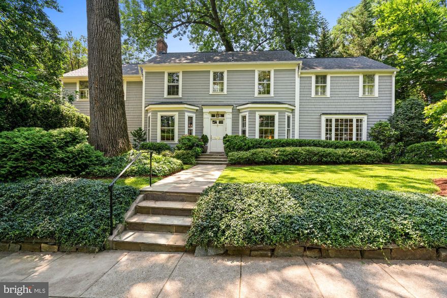 Set on a picturesque corner lot surrounded by mature trees and landscaping, this exquisite residence is an excellent example of American shingle style architecture—a tradition made popular by the New England School of Architecture. Blending English influences with a revived appreciation for Colonial American design, the home’s expansive shingle façade evokes the timeless character of Nantucket and Cape Cod, while offering modern comfort and sophistication in one of Washington’s most sought-after neighborhoods, Wesley Heights.
 
The home features an elegant formal living room with high ceilings and a fireplace, a generously scaled dining room with a wet bar and additional fireplace, and an open kitchen with a breakfast area and spacious family room, perfect for family gatherings. Multiple outdoor entertaining areas are framed by lush landscaping, offering both privacy and tranquility. French doors from the living room open to the patio. A rear deck off the kitchen provides the perfect space for al fresco dining. Additionally, a third outdoor area is a generous, flat yard off the family room and kitchen. There is an additional reception area and a powder room located on this level of the residence. Windows are abundant, filling the home with natural light from all directions.
 
Upstairs, the spacious primary suite has vaulted ceilings, a skylight, and a third fireplace. It offers a peaceful, spa-like bathroom complete with a frameless glass shower, soaking tub, and dual vanity. Two additional bedrooms share a well-appointed hall bathroom, while a generous fourth bedroom, also with a high ceiling, features its own en-suite bathroom. Laundry is conveniently located on this level. The finished lower level, with a separate entrance, includes a fifth bedroom, a full bathroom, gym area, and storage.
 
Ideally located in one of D.C.’s most desirable neighborhoods, this home is within walking distance to Horace Mann Elementary School, American University, and the vibrant shops, restaurants, and parks along New Mexico Avenue. Enjoy convenient access to the Palisades, Glover Park, and Georgetown—all while living in a private, tree-lined enclave. This residence is a rare opportunity to own a home that combines classic American architecture with exceptional livability in a premier Washington location.