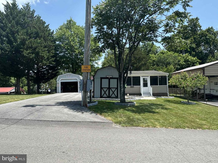 Welcome to Block 69 lots 28 & 29 Ranger Rd in Falling Waters, Wv. 
A drivable distance from all the cities in MD, PA and VA. Beautiful corner lots have been extremely well maintained both equipped with water, sewer and electric that are included with the annual dues of $1,775 each.
Block 28 features a 2008 Crossroads Tranquility Park model home that is nothing short of excellent condition. Live here as a snowbird for the season or use it as your weekend getaway. The Park model has a full living room with a sectional couch that pull out into a queen size bed, custom fitted blinds, a full kitchen to satisfy all your cooking needs with spacious cabinetry, a standard size bathroom, and primary queen bedroom with its own entrance. The high ceilings bring that spacious feeling that traditional campers don't have. 2 Mini splits for heating and air.  It has recess lighting and a speaker system throughout. Attached you'll find the 12.5 * 20 Heavy Duty screened in porch (All the furniture conveys) with a ceiling fan to keep that air moving while you are relaxing and or hosting friends and family.  Also, conveying is a 12 * 10 bunkhouse large enough for queen sized bedroom suite to fit for your extra guests (Has A/C) and a 16 * 14 workshop - storage shed large enough to house a full-size side by side utility vehicle and a heavy-duty floor was installed.  The 2015 Teryx is also for sale for an additional $8,250. It's never been in the mud or driven off the pavement. Perfect condition. 

 Riverbend is 400 Acres of SEASONAL recreational campground full of amenities located on the Potomac River in Falling Waters, Wv. OPEN APRIL 1 - NOVEMBER 1 - This is a fun & entertaining community, yet relaxing where You own your own lot. No more renting. Make it your Home away from home. Approx. 10 miles of Deep water on the Potomac River access for boating, fishing & swimming. Yearly membership ($1,775)* 2 plus a $200 initiation fee for new owners, includes water, this one is on sewer, electric, trash and the park amenities such as 3 pools, putt putt course, Horseshoe club, Boat club, Poker runs, Trick or Treat, Christmas in July, live bands, basketball court, tennis court, fireworks, car show, Church, restaurant, bar, convenience store (Great food), playground, volleyball, ball field and much much more. Bring your golf carts, water toys and come enjoy life!