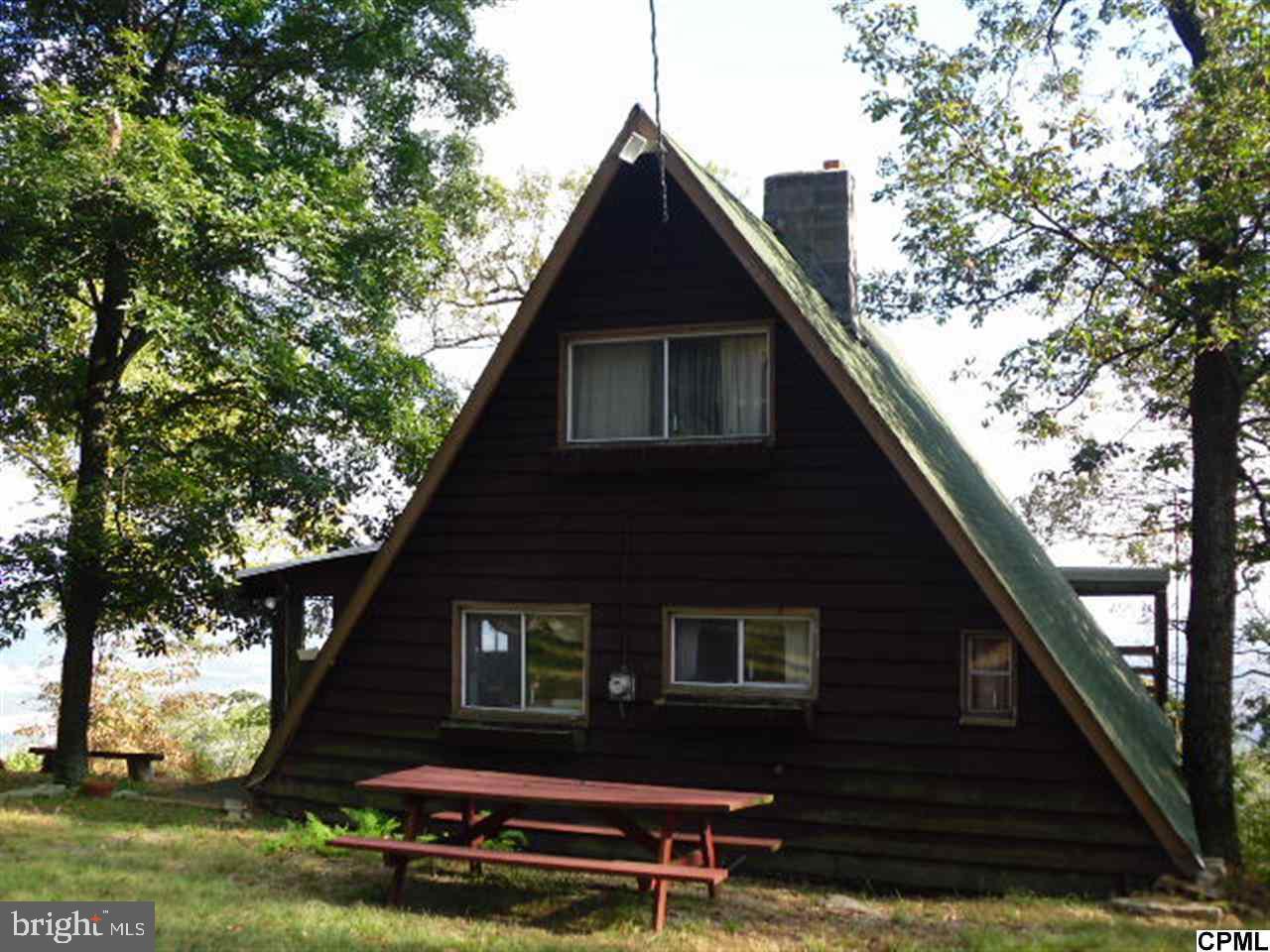 MILLION DOLLAR VIEWS! RARE OPPORTUNITY TO OWN A HOME THAT YOU CAN SEE FROM HARRISBURG TO CHAMBERSBURG FROM YOUR BACK DECK. A-FRAME HOME OFFERS 2 BEDROOMS, 1 BATH, WOOD STOVE, 1.6 ACRES, WELL & SEPTIC. EXPERIENCE NATURE AT ITS FINEST. BEING SOLD AS IS.