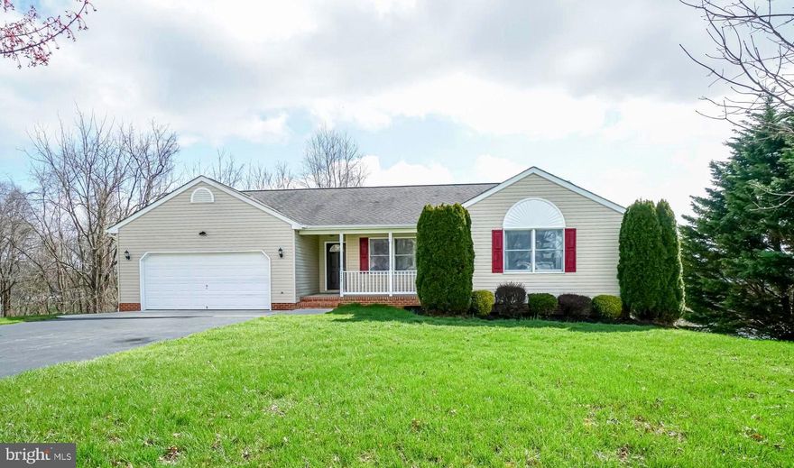 Spectacular rancher in Rising Sun!  This spacious three bedroom, two and a half bath home features large rooms, open floor plan, main level laundry, a front porch, a two car garage, and a full unfinished basement with a walk out and rough in for a full bath.  Scenic views from the rear deck!