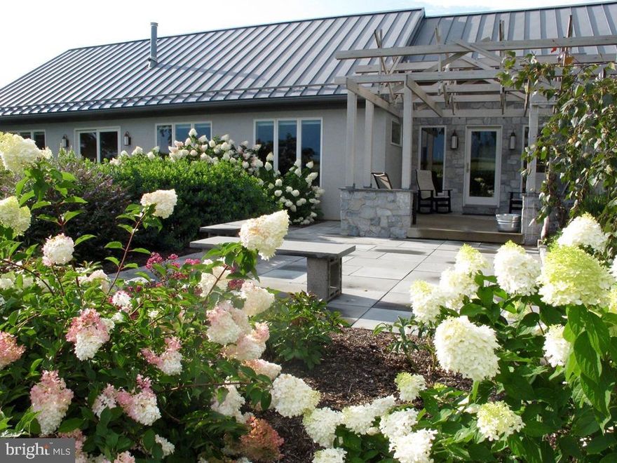 Contemporary CUSTOM built home by Mark Sensenig of Lititz. Panoramic views of hundreds of acres of farmland with beautiful views, abundant natural light, Updated, Bright and Gorgeous. This home could be a 3 bedroom home. A three sided gas (propane) fireplace, large eat-in area with Natural Quartzite Stone countertops and custom maple cabinets by Plain & Fancy. No expense spared for a serious chef who will be equipped with the finest selected appliances for each culinary task, top-of-the-line models from 36" Thermador Stove and Viking hood all those sought-after high-end amenities, Set up for dual-fuel range. Lots of Anderson Windows, Vaulted ceilings, home is Passive solar.