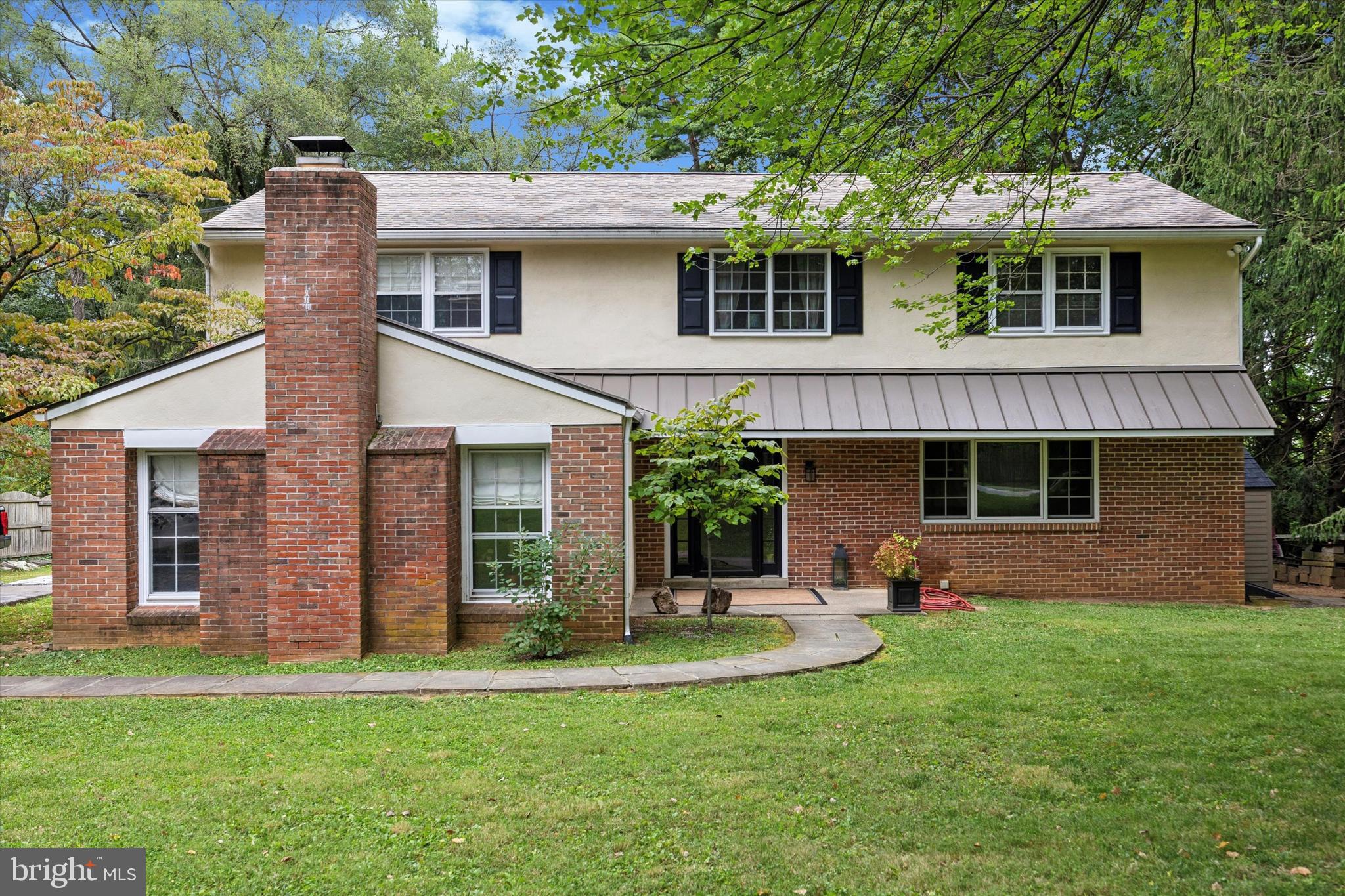 Welcome to this expansive 4-bedroom, 2.5-bath Colonial, nestled in the highly desirable Lafayette Hill section of Springfield Township. This move-in ready home has been meticulously cared for over the years and is sure to impress. With plenty of living space and endless potential to expand the kitchen and other spaces, this home is an entertainer's dream.
The main floor greets you with a lovely center hall and a light filled formal living room featuring elegant glass French doors and a wonderful bay window. Enjoy the cozy family room with a beautiful brick fireplace, beamed ceiling, wet bar, ample closet space, plus access to the side yard. Just beyond the family room, you'll find a convenient laundry area and a den/office with an additional fireplace, as well as a powder room. The spacious eat-in kitchen includes newer stainless steel appliances and offers plenty of room to cook and entertain, with access to the back terrace for seamless indoor-outdoor living. A formal dining room completes this level, connected to the living room by another set of beautiful glass French doors.
Upstairs, the primary suite is expansive, with plenty of space for a sitting area. Enjoy a newly renovated en-suite bathroom with a stall shower, and a thoughtfully designed walk-in closet with a built-in closet system. Three additional generously sized bedrooms and a full hall bathroom round out the second floor.
The unfinished basement offers even more potential living space with a drop ceiling, walls, and outdoor access through a newer Bilco door and stairs. You'll also find a dedicated workshop area for your DIY projects.
Other improvements include hardwood floors throughout, central air, roof replaced in approximately 2015, hot water heater replaced in 2022, new HVAC in 2022, upgraded electric to 200 amp, some newer windows and front door, meticulous exterior landscaping and hardscaping and so much more!
Now onto the two tiered expansive and private yard. Situated on over a half of an acre, there are many amazing spaces to create your very own back yard oasis. Enjoy the back terrace with a newer paver retaining wall overlooking the lush private grounds. The driveway offers plenty of parking and a turnaround spot. The location can’t be beat just a few houses from Whitemarsh Valley Golf Course, walkable to Chestnut Hill shops and retail, local treasures like The Morris Arboretum and Woodmere Art museum and the Wissahickon/Northwest Avenue. Also centrally located within minutes to Plymouth Meeting, Flourtown and access to major routes like 476 and 309. Take advantage of Springfield Township Schools!