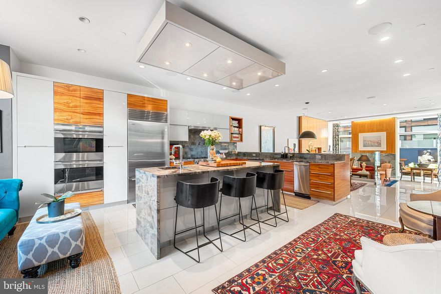 Sophisticated 4-bedroom Home in the heart of Logan Square.
This exceptional residence offers over 5,000 square feet of meticulously crafted living space, including 4 spacious bedrooms, a library/media room, family room, and 6 full baths + 2 powder rooms—all exuding modern elegance and thoughtful design.
The home welcomes you with a finished entry level featuring a private guest suite, a large gym, and access to a TWO-CAR GARAGE. An elevator conveniently serves every level, right up to the spectacular rooftop deck.
Designed with entertaining and comfort in mind, the main living area impresses with soaring ceilings, a gas fireplace, and expansive west-facing floor-to-ceiling windows that open onto a serene terrace—perfect for gatherings or quiet moments. the chef’s kitchen is a culinary dream, outfitted with premium appliances, abundant cabinetry, and elegant finishes. The open dining area seamlessly connects for easy flow and entertaining. Heated floors add warmth and luxury throughout the main level.
The primary suite encompasses an entire floor, offering a tranquil retreat with spectacular city views, extensive closet space, and a spa-like bathroom featuring heated floors, a deep SOAKING TUB, and a GLASS-ENCLOSED STEAM RAIN SHOWER. Adjacent, the library/media room with its own fireplace provides the ideal space to relax or work in privacy.
The upper level features two generously sized bedrooms, each with en-suite bathrooms, an OUTDOOR TERRACE, and an additional family/media room/work from home area.
Top it all off with the pilot house level, which includes a micro kitchen and powder room, opening to an expansive rooftop deck. Take in panoramic skyline views from multiple lounge and dining areas—or unwind in the hot tub and sauna while stargazing.
Craftsmanship, quality, and attention to detail are evident in every corner of this extraordinary home. Enjoy premier access to Philadelphia’s finest dining, shopping, and cultural landmarks, with institutions like the University of Pennsylvania, Penn Medicine, Drexel University, and the Center City business district all within easy reach. Located within the Greenfield School Catchment, and steps from the Schuylkill River Trail, top museums, food markets, and urban green spaces—this is city living at its finest.