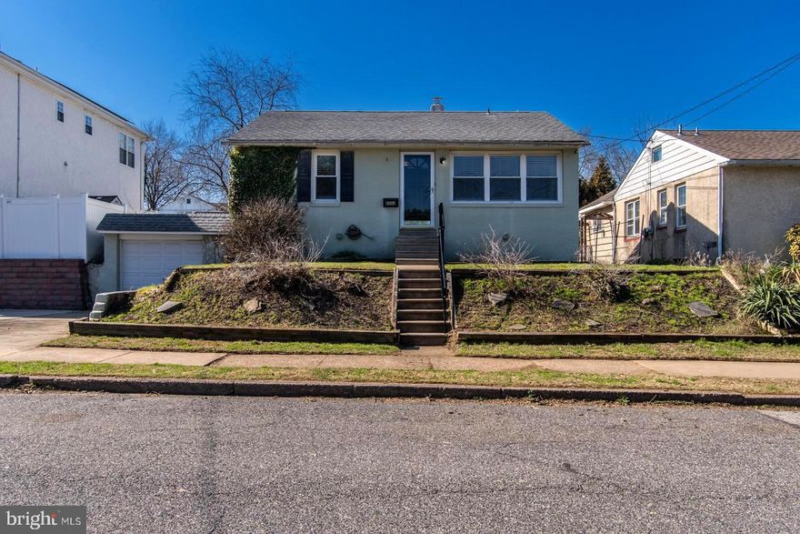 Rarely offered, beautifully updated single rancher w/ HUGE fenced yard, expansive  finished basement, and modern updates including central air & NEW windows - situated on a great block in Fox Chase just steps to Pennypack Park at the corner, this home offers the perfect blend of comfort and style.

Enter to find a spacious living room w/ gorgeous refinished hardwood flooring , enhanced by recessed lighting and abundant natural light. Modern kitchen lined w/ crisp white cabinetry, stunning Black Galaxy granite counters and subway tiled backsplash, recessed lighting and updated appliances, and exit to covered rear patio ideal for indoor-outdoor living & entertaining.

The updated full bath boasts beadboard wainscoting, classic pedestal sink w/ LED mirror + overhead lighting, tiled tub/shower, and convenient linen closet.  2 large bedrooms w/ closets, one w/ ceiling fan & other w/ decorative wood trim accent wall.

A massive finished & waterproofed basement offers tons of extra living space & durable LVT flooring, separate laundry room featuring newer mechanicals, and inside access to an oversized garage leading to the private driveway in the front and Bilco doors with access to the rear yard. 

Exterior highlights include mature landscaping in both front & back getting ready to bloom, and a massive fenced grass yard beyond the covered concrete patio, allowing for a variety of uses including pets, recreation, gardening, entertaining, or your outdoor oasis.

A rare opportunity with so many positive features at an excellent price point for a single.....don't miss it!