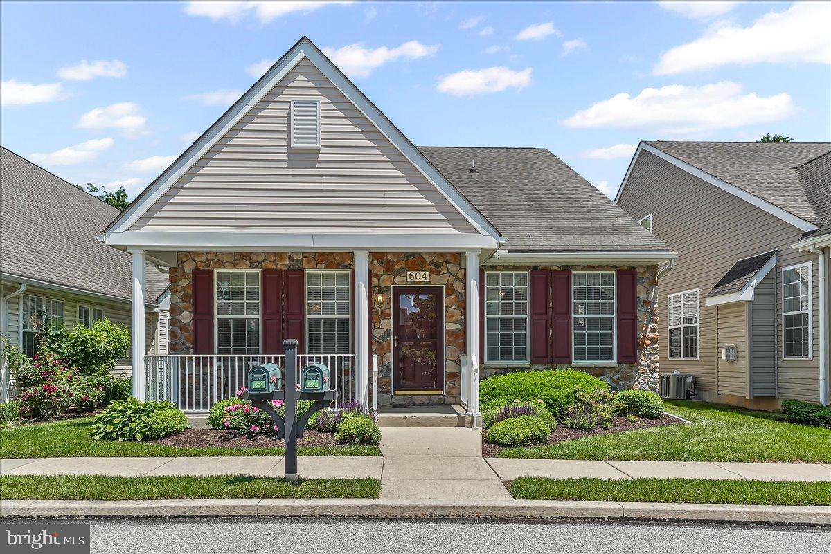 Welcome to 604 Rose Tree Ln, located in the beautiful Victoria Gardens 55+ community. This charming 3-bedroom, 3-bathroom cottage-style home offers everything you’ve been looking for. Step inside to a spacious living room featuring cathedral ceilings and a cozy gas fireplace—the perfect spot to relax or entertain. The open layout leads to a generously sized eat-in kitchen and a bright sitting room with access to your private deck and 2-car garage. Just off the kitchen, you’ll find a convenient laundry room. The oversized primary suite includes two walk-in closets and a well-appointed en-suite bath. Also on the main level is a second bedroom or office, along with another full bathroom. Upstairs, your guests will love the spacious third bedroom, full bath, and loft area—ideal for a sitting room, hobby space, or additional home office. The home also features a full basement to meet all your storage needs. Enjoy a vibrant lifestyle with access to the community’s clubhouse, outdoor pool, meeting rooms, kitchen, exercise room, and more. All of this just minutes from Longwood Gardens, Route 1, and the best of Kennett Square.