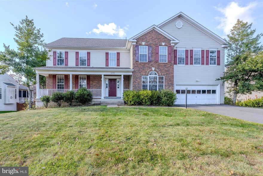 Nestled on a lovely level .66 acre lot in the desirable Fox Hollow community, this spacious Calvert Homes Talbot model colonial offers 6 bedrooms, 3.5 baths, over 5,900 finished square feet of living space on three levels and fresh new paint throughout! A tailored brick and siding exterior with front porch, generous sized driveway and 2-car garage, custom multi-level decks, and a lush yard with a sprinkler system dotted with majestic trees creates outdoor appeal. Inside, an open floor plan, high ceilings, hardwood flooring, decorative moldings, generous room sizes, 2 fireplaces, built-ins, and an abundance of windows are just some features that make this home special. ****** A grand two story foyer with gleaming hardwood flooring welcome you home. To the left, you’ll find the formal living room with twin windows and crown molding, and the formal dining room accented by a bay window, wainscoting, and a glass shaded chandelier with ceiling medallion adding refined style. The light filled open concept kitchen features granite countertops, an abundance of 42” cabinetry, center island, a planning center, and a sun filled breakfast area that is ideal for daily dining. Here, a French style door grants access to the large custom tired deck with descending steps to a 2nd deck and the oversized level backyard, perfect for gatherings, nature watching, and simple relaxation. Back inside, the sunken family room with walls of windows invites you to relax and unwind in front of a cozy fireplace, while the open layout makes entertaining a breeze. A library that makes a great home office, powder room, and laundry/mudroom round out the main level. ****** Upstairs, the owner’s suite is your own private retreat boasting a wall of windows, a lighted ceiling fan, walk-in closet with custom organizers, and an ensuite bath featuring a dual sink vanity, water closet, corner soaking tub, and oversized glass enclosed shower. Down the hall, 4 generously sized bedrooms, each with lighted ceiling fans and two with walk-in closets, share easy access to the well-appointed hall bath. ****** The expansive walk-out lower level recreation room provides plenty of space for games and media and is sure to be a popular destination. A large den with built-in bookcases provides versatile living space, and a 6th bedroom with a walk-in closet and private entry to the dual entry full bath makes a great guest suite and completes the comfort and luxury of this wonderful home. ****** All this in a peaceful community in a stellar mid-county location that is super convenient to Hoadly Road, Route 234, Prince William Parkway, I-95, Express Lanes, and the VRE. There is plenty of diverse shopping, dining, and entertainment options in every direction and the home is located in the highly desirable Colgan High School pyramid. Enjoy the Prince William Aquatics Center or Prince William Forest Park with miles of hiking trails, nature activities and camping. For a masterpiece of design with an abundance of living space offering a relaxing yet convenient lifestyle, this is it! New photos coming soon!