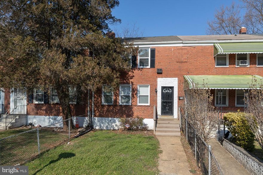 Indulge in a comfortable and easy-care lifestyle in this delightful 4-bedroom, 2-bath Baltimore brick townhome located in the East Arlington neighborhood! Welcoming you is a gated front yard where you can sip coffee on the verdant lawn and become acquainted with passing neighbors. Past the steps, enter an open-concept, modern interior finished in neutral tones and dark wood-style flooring. Radiant sunlight streams through double-hung windows, creating a vibrant atmosphere for entertaining. Relax with guests in the well-proportioned living area before serving a sumptuous feast in the adjacent dining corner. Whip up culinary magic in the kitchen, equipped with a host of appliances, ample cabinetry, and a pantry. Upstairs, three carpeted bedrooms with abundant storage await you after a long day, including the primary suite with its double closets and an adjoining versatile bonus room that can be utilized as an office. A main-level bedroom catered by a shared full bath is an ideal accommodation for your overnight company. Downstairs, a well-sized unfinished basement sparks plenty of possibilities; it can be a recreational area, a gym, or a creative studio. Through its access door, step outside to the tranquil backyard where you can gather for weekend BBQs and other leisurely activities. With schools, parks, and public transportation easily accessible, why wait? Come for a tour before it’s gone for good!
