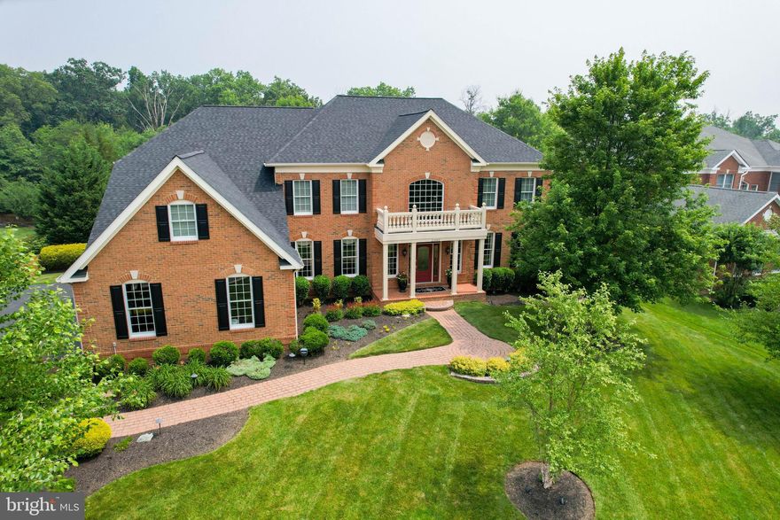 OPEN HOUSE ON SUNDAY, JULY 2, IS CANCELLED! This Toll Bros Hampton model is located in SOUTH RIDING'S Cedar Hunt neighborhood known for its stately homes on premier lots. Nestled on a generous .47-acre lot, here's a home offering the perfect blend of elegance, comfort, and outdoor entertainment. The owners have meticulously enhanced and upgraded not only the property's systems (roof, HVAC, pool equipment) but also the quality of living here (a covered porch, expanded decking, the finished basement & more).  A spacious and beautifully designed interior that exudes warmth and sophistication with its open floor plan that seamlessly connects the Living, banquet-sized Dining, and Kitchen areas to create an ideal space for hosting gatherings and fostering a sense of togetherness. Wonderful Kitchen is a chef's dream with a HUGE center island with bar seating AND a walk-in pantry. It's the heart of the home where simple to fancy fare is prepared and shared. Easy hosting is helped by the under-counter ice maker and a butler's pantry. MOVE THE PARTY OUTSIDE! The stunning enclosed porch, set under skylights, has a stacked-stone hearth gas fireplace and leads to an open sun deck - both areas enjoy elevated views of the picturesque pool and lush grounds below. Whether hosting a summer barbecue or simply enjoying a peaceful morning coffee, it's the perfect place to enjoy the beautiful surroundings!  The pool area is meticulously landscaped with a hardscape patio surround, lush greenery and seasonal flowers, and an open lawn. Cool off on hot summer days, swim laps to stay active, or simply relax by the water's edge with a good book.  Back inside, the 2-story family room features a stone hearth gas fireplace hugged by windows. A private study/office has handsome built-in bookcases. The upper level has FOUR Bedroom suites - all with their own well-appointed en-suite baths.  The primary Bedroom suite is its own private sanctuary. In addition to the huge bed area and adjoining sitting room, the spa-like Bath is complete with a center soaking tub, walk-in shower, dual sink vanities, and two water closets. The centerpiece of this area is the huge windowed Dressing Room with custom built-ins and a dressing table offering luxurious and functional storage. Downstairs is the ultimate Recreation Room, newly finished into a space designed for entertainment, relaxation, and endless fun! This expansive area combines a media space with an electric fireplace, a game area, and tasteful granite pub-style bar, creating the perfect atmosphere for hosting gatherings and enjoying leisurely activities.  Wait, there's more! This level has also been fitted with a large fitness/workout room and a craft/hobby/gift wrapping room with custom built-ins. Don't miss the opportunity to own this true slice of paradise with all the benefits of living in SOUTH RIDING - local amenities, schools, including  Paul VI High School, parks, and shopping centers.  SO MANY UPGRADES AND REPLACEMENTS - COME AND SEE!