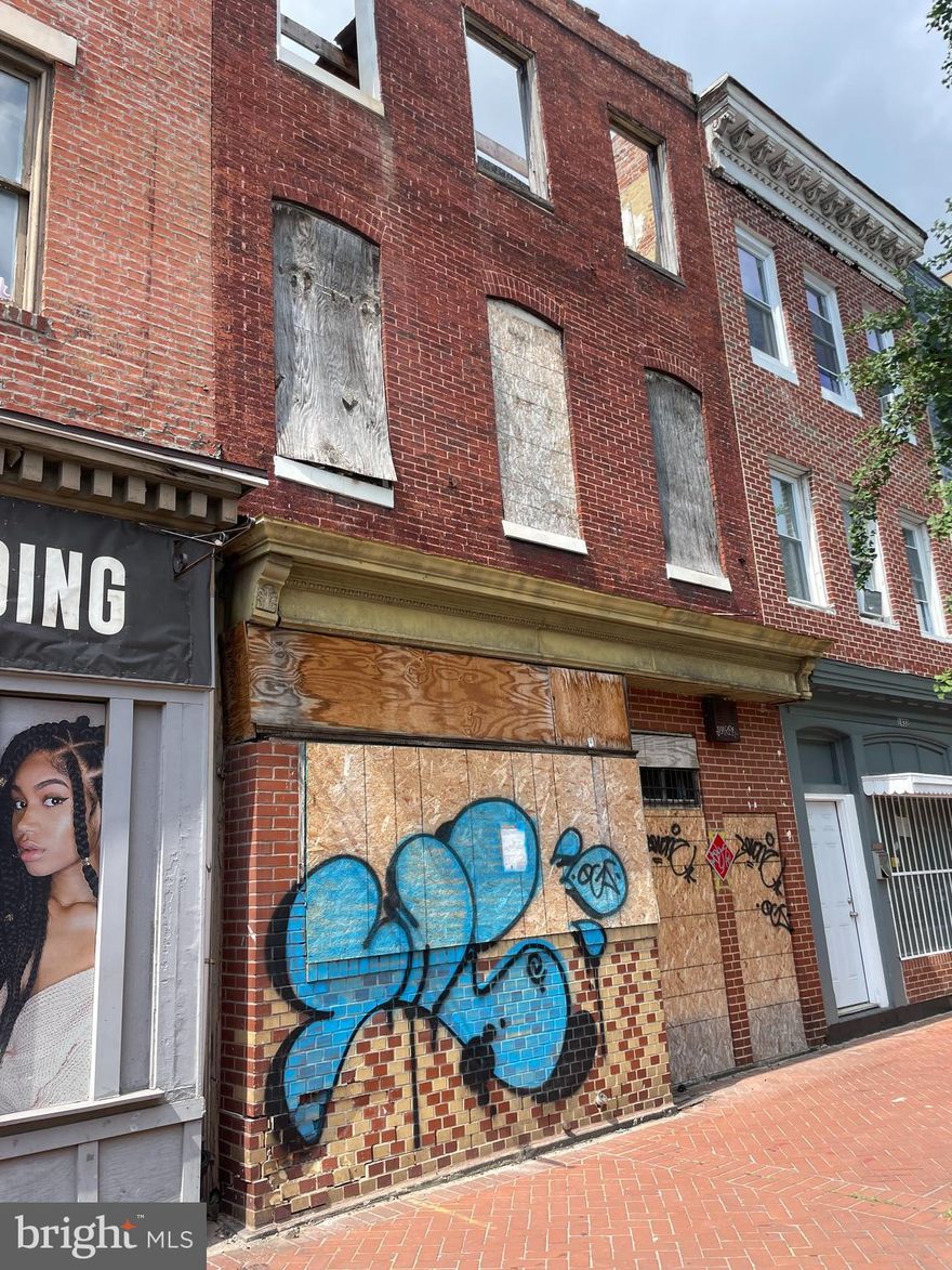 Property is a shell with drawings and permits in place.  Main floor can house a business or rental, off street parking with potential for roof top deck.