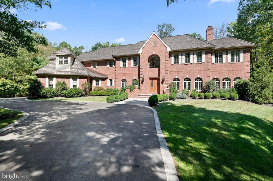 Introducing 134 Jaffrey Road, an elegant and stately home situated on 2.3 picturesque acres in the heart of Radnor Hunt and on one of it's most coveted streets! This custom, all brick home boasts 10ft ceilings on first floor and 9ft on second floor, Brazilian cherry wood floors, wainscoting, decorative moldings, oversized windows, transoms, and skylights- this impressive home will exceed the expectations of even the most discerning buyer. A beautiful grand foyer welcomes you into the home, and to the right is the formal living room with gas fireplace. Glass doors open to the light-filled sunroom, perfect for relaxing and granting access to the large deck with wrought iron railings. The handsome first floor study features a cozy fireplace, shelving, and doors that open to a lovely flagstone patio. Entertaining for large gatherings will be a breeze with the spacious formal dining room and adjacent butlers pantry (equipped with dishwasher and wine cooler). Step into the kitchen that has been expertly designed and is every cook's dream. You'll love the custom cabinetry, the expansive center island, the high-end appliances including double ovens, 6 burner cooktop, and large sub-zero fridge. The adjoining breakfast room has walls of arched windows, providing an abundance of natural light and beautiful views, and doors from the breakfast room open to a patio for alfresco dining. The expansive family room with large windows, skylights, and fireplace is adjacent to the kitchen, opens to the patio and offers yet another place to gather family and friends. A formal powder room, a mudroom with access to garage, a full bathroom, and a laundry room complete the main level. Upstairs, an exquisite primary suite awaits, featuring a sitting area with fireplace, a sunroom opening to a private deck, walk-in closets and a spa-like primary bath with jacuzzi tub, separate shower, and dual vanities. Also on the second level are four additional bedrooms, each generously sized with ample closets, three spacious bathrooms, plus a cedar closet. A staircase leads to a huge attic that provides plenty of storage and has the potential to be finished. Designed for entertaining, the lower level of this amazing home is walk-out and adds an additional 1200sqft of living space. A custom bar with mahogany top, large living/seating area, brick-walled fireplace, and powder room complete this luxurious space. Off of the finished basement is an utility area with a sink where you can keep a lawn tractor, yard gear, etc.
The outdoor space features beautiful views of the grounds, multi-level flagstone patios, brick pillars, private decks, and three custom built-in hooded grills - perfect for wood-burning pizza! Great location - award-winning Great Valley School District, just minutes to all the shopping and dining options of Malvern and West Chester, close to all major roadways and Paoli train station for an easy commute to Philadelphia and Wilmington, and minutes to Malvern Prep, Villa Maria Academy, and Episcopal Academy! Call today to see this magnificent property; you will not want to miss this one!