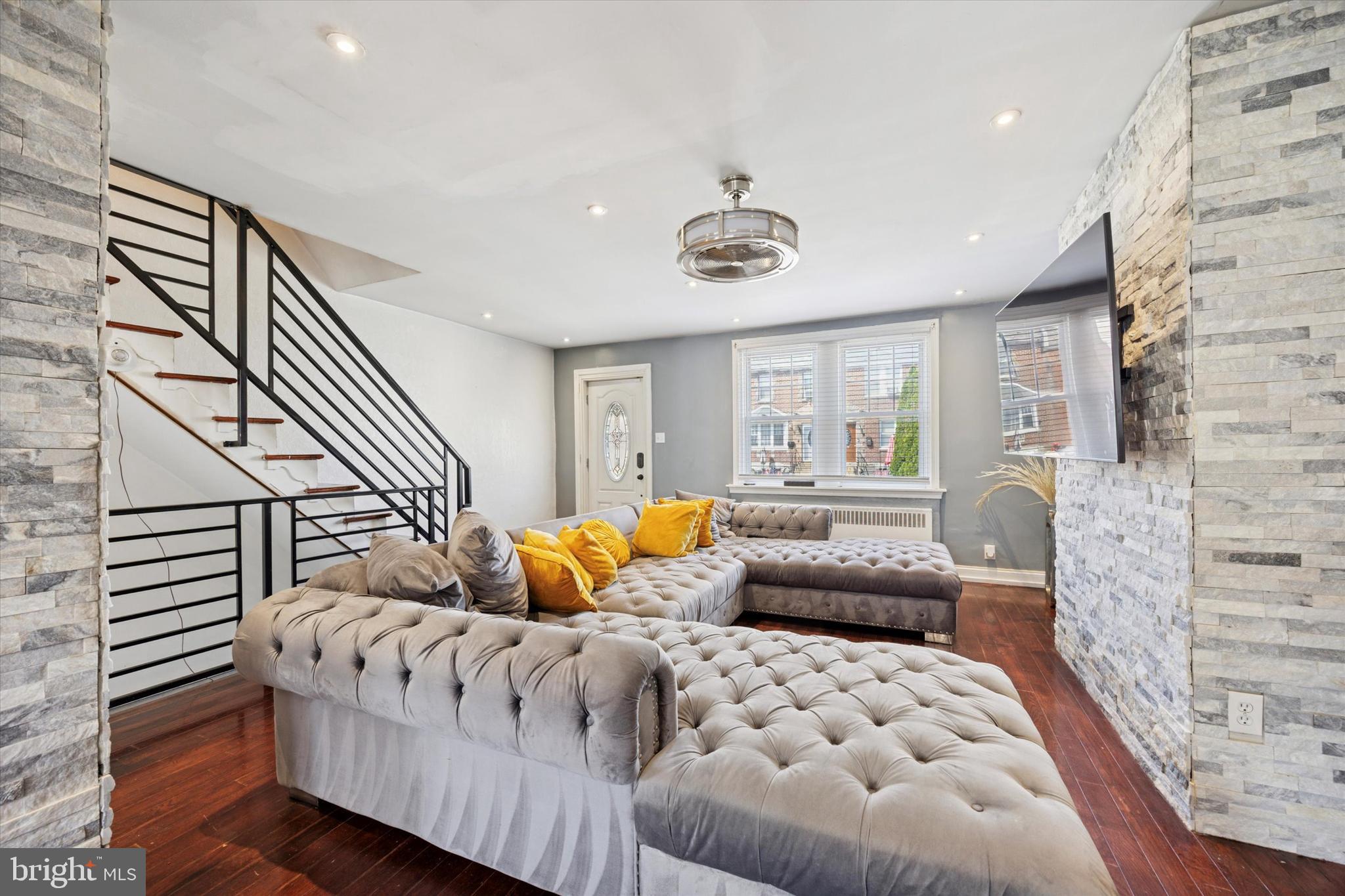Thinking About Moving to the Northeast? Your Next Home Awaits in Mayfair! Welcome to this beautifully updated townhome in the heart of Mayfair, one of Northeast Philadelphia’s most charming and accessible neighborhoods. Just two blocks from the vibrant Frankford Avenue corridor, you’ll enjoy easy access to local shops, public transportation, and a variety of community events — all right outside your door. Step onto the spacious front patio, perfect for relaxing evenings or entertaining guests. Inside, you’ll be welcomed by warm hardwood flooring, sleek recessed lighting, and a modern kitchen featuring gray soft-close cabinetry that adds both style and function. This well-maintained home offers 3 comfortable bedrooms and 2 full bathrooms — including one in the fully finished basement, ideal for guests, a home office, or additional living space. Renovated just under five years ago, this home blends classic charm with modern updates. Whether you're a first-time buyer or an investor looking for a move-in ready property in a growing area, this is a fantastic opportunity. The seller is highly motivated — don’t miss your chance to make this home yours!
