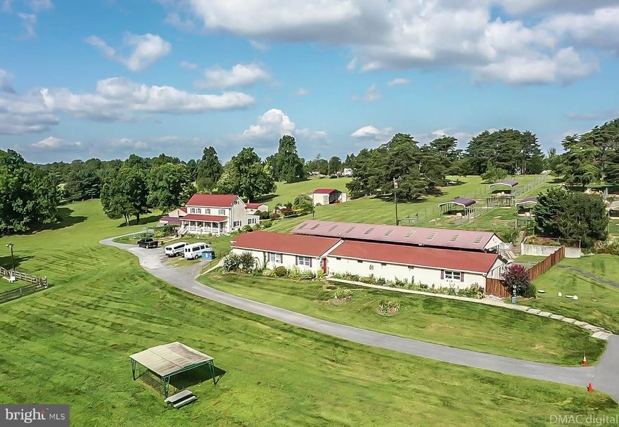 Beautiful private 18.45 acre setting. Family farm / kennel operation with a special zoning exception. Farm house features 3 BR 2 FBA approx 2,400 sqft +/-,  large country kitchen, dining area with wood floors, deck off rear,  main level bedroom and full bath, upper level has 2 bedrooms , full bath , large pond, many out buildings. Detached garage w/ heat/ AC system & electric and additional kennel runs on the side. Kennel building is 3,632 sqft w/ bathroom, plus 1,560 sqft with Kennel runs ,10 paddocks ,1 100" X 100 " lighted (flood lights) play yard / training area / event area
Cattery room,  Kitchen with 5 stainless steel restaurant sinks, 2 stainless steel bathing tubs 1 with ramp & many banks of drop crates, stainless steel cages, private office, lobby with retail area. Security system with video surveillance Great location between Baltimore & Frederick minutes from interstate 70 .
